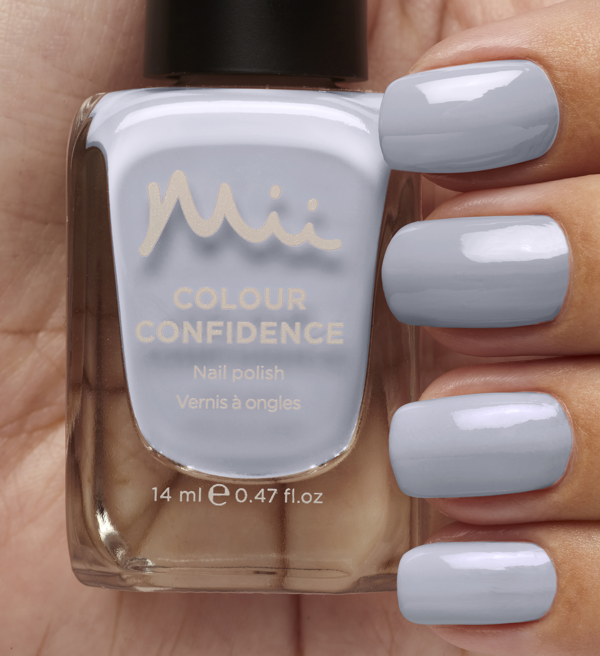 Model wearing and holding Earl Grey Colour Confidence Nail Polish