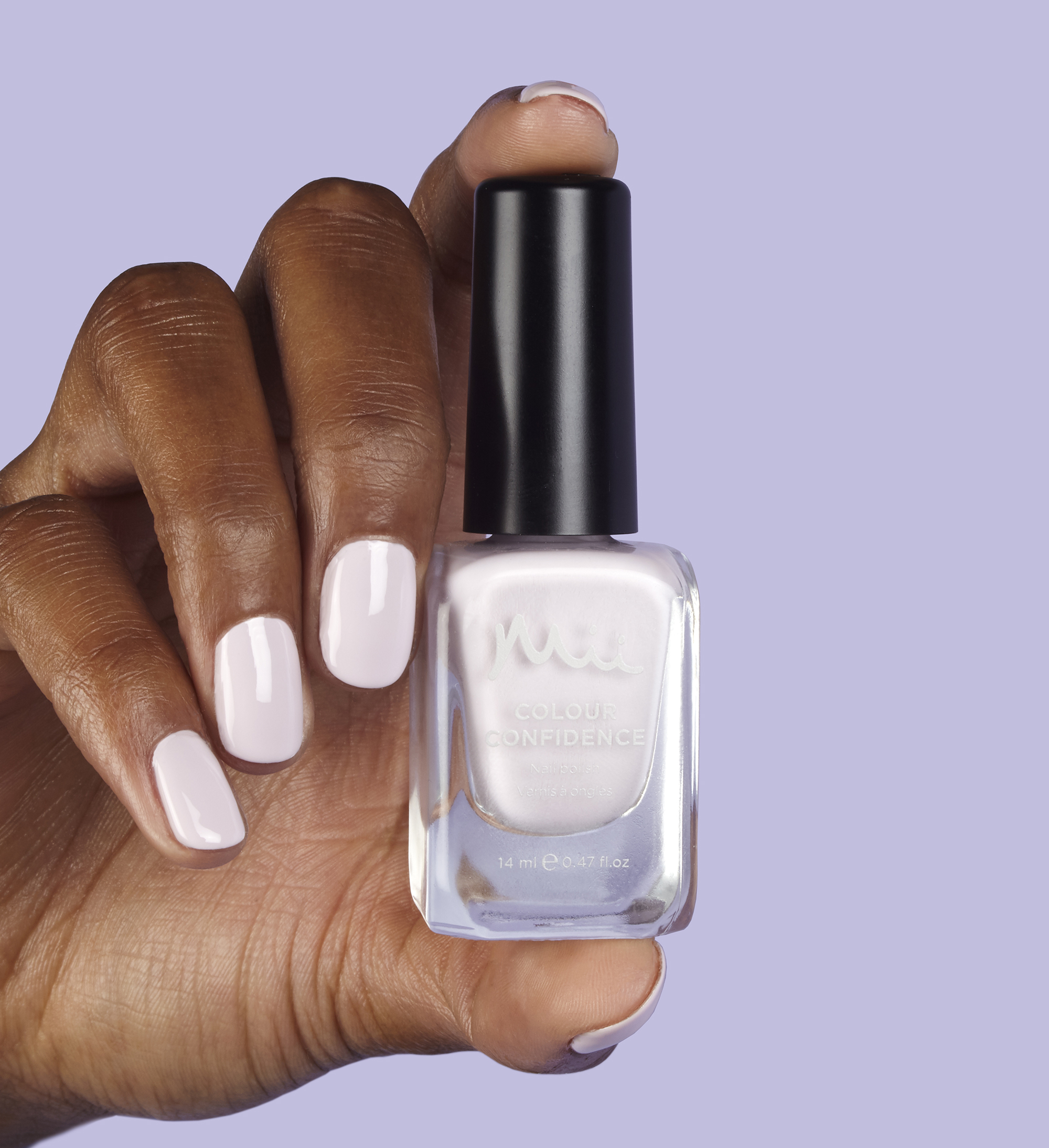 Model holding and wearing Lavender Macaroon Colour Confidence Nail Polish