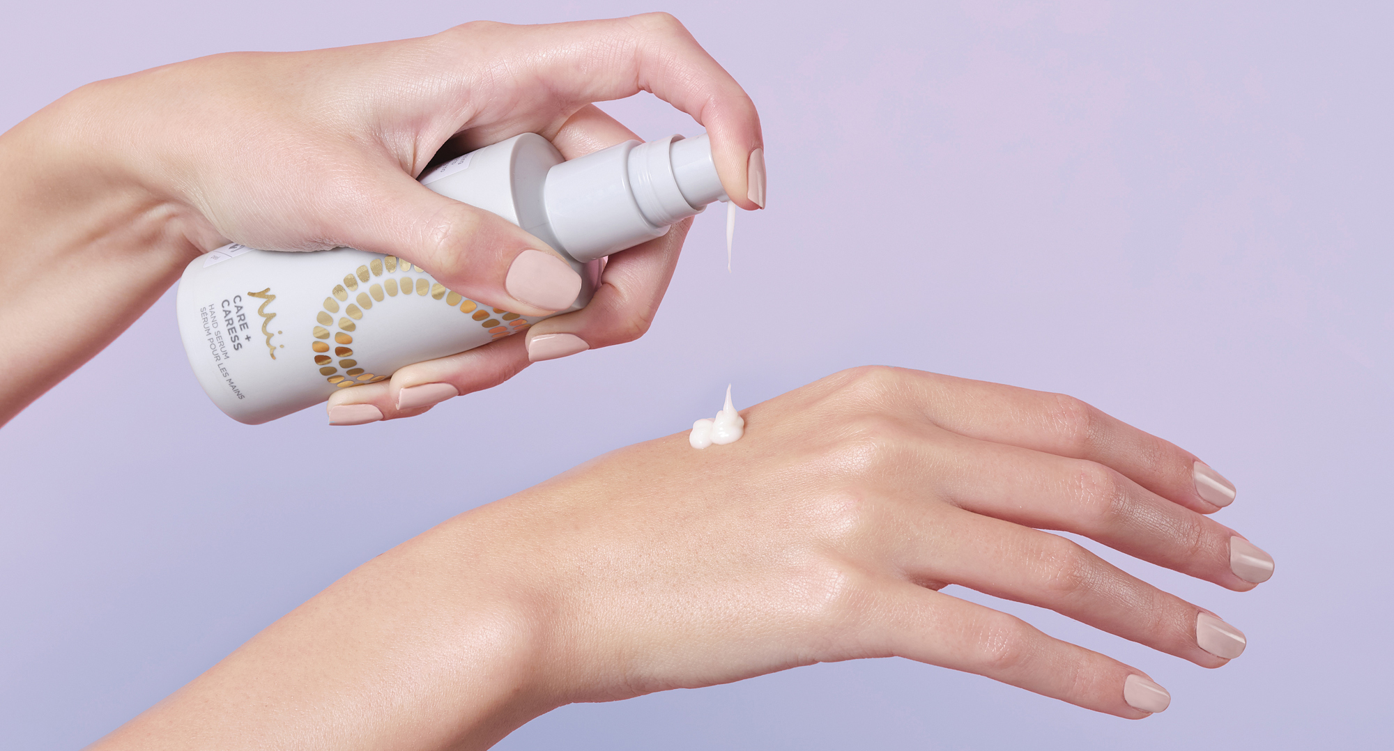 Model applying Care + Caress Hand Serum