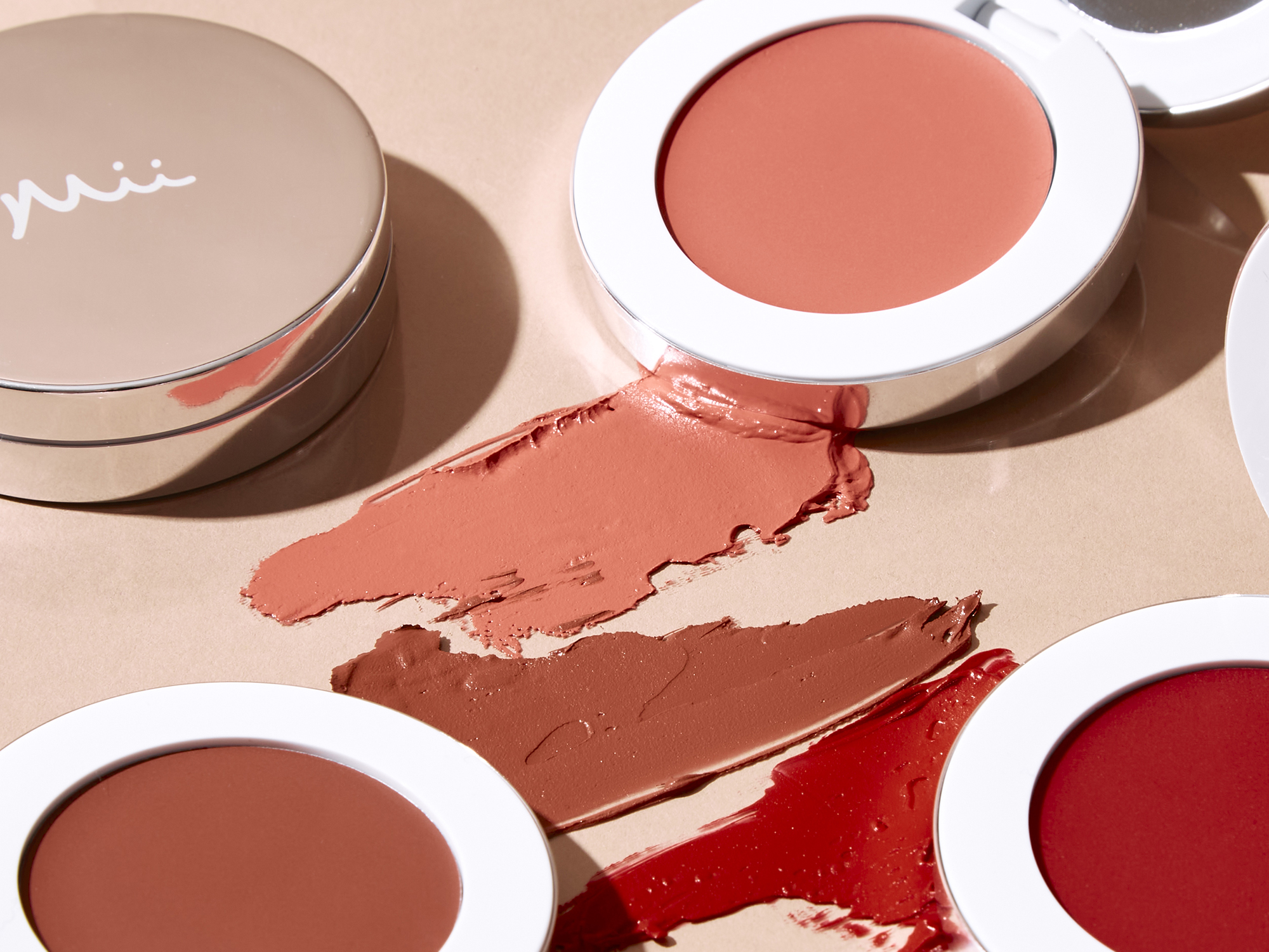 Colour Wonder Lip and Cheek Balm group shot with swatch texture