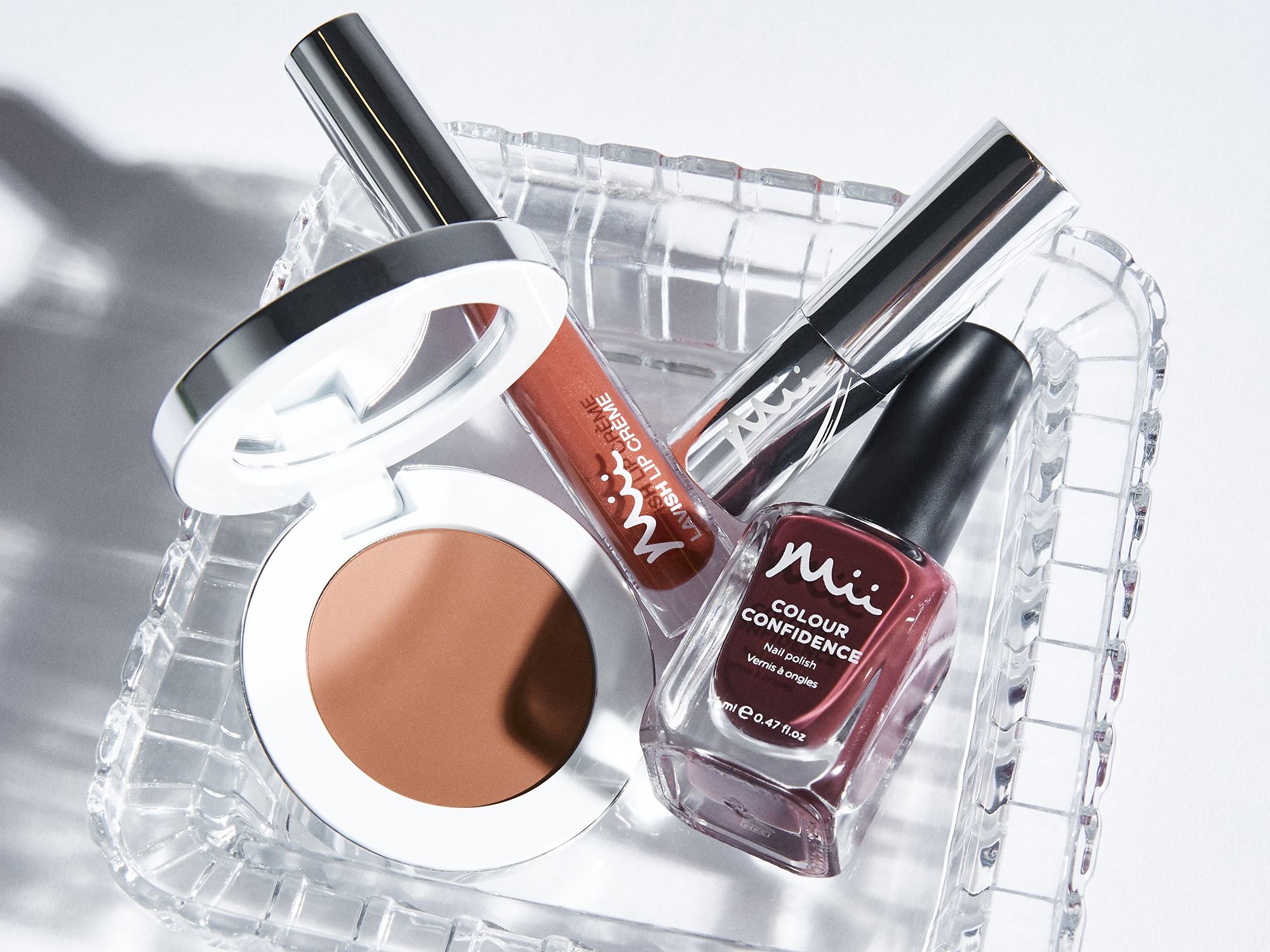 Group shot featuring Colour Wonder Lip and Cheek Balm, Colour Confidence Nail Polish, Lavish Lip Creme Lip Gloss and Hydraboost Lip Lover Lipstick
