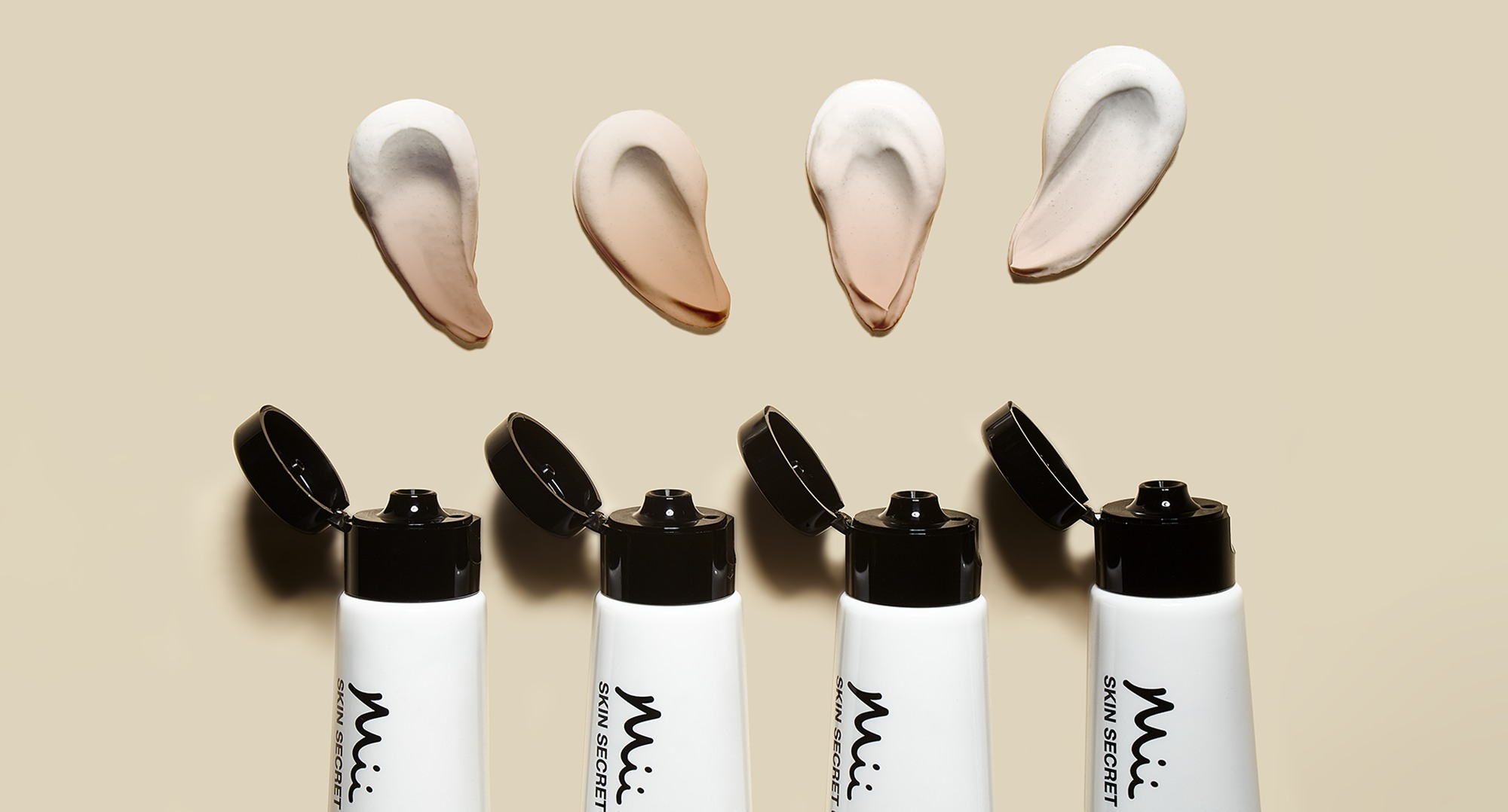 Stylised shot with swatches of Skin Secret Cream Tint
