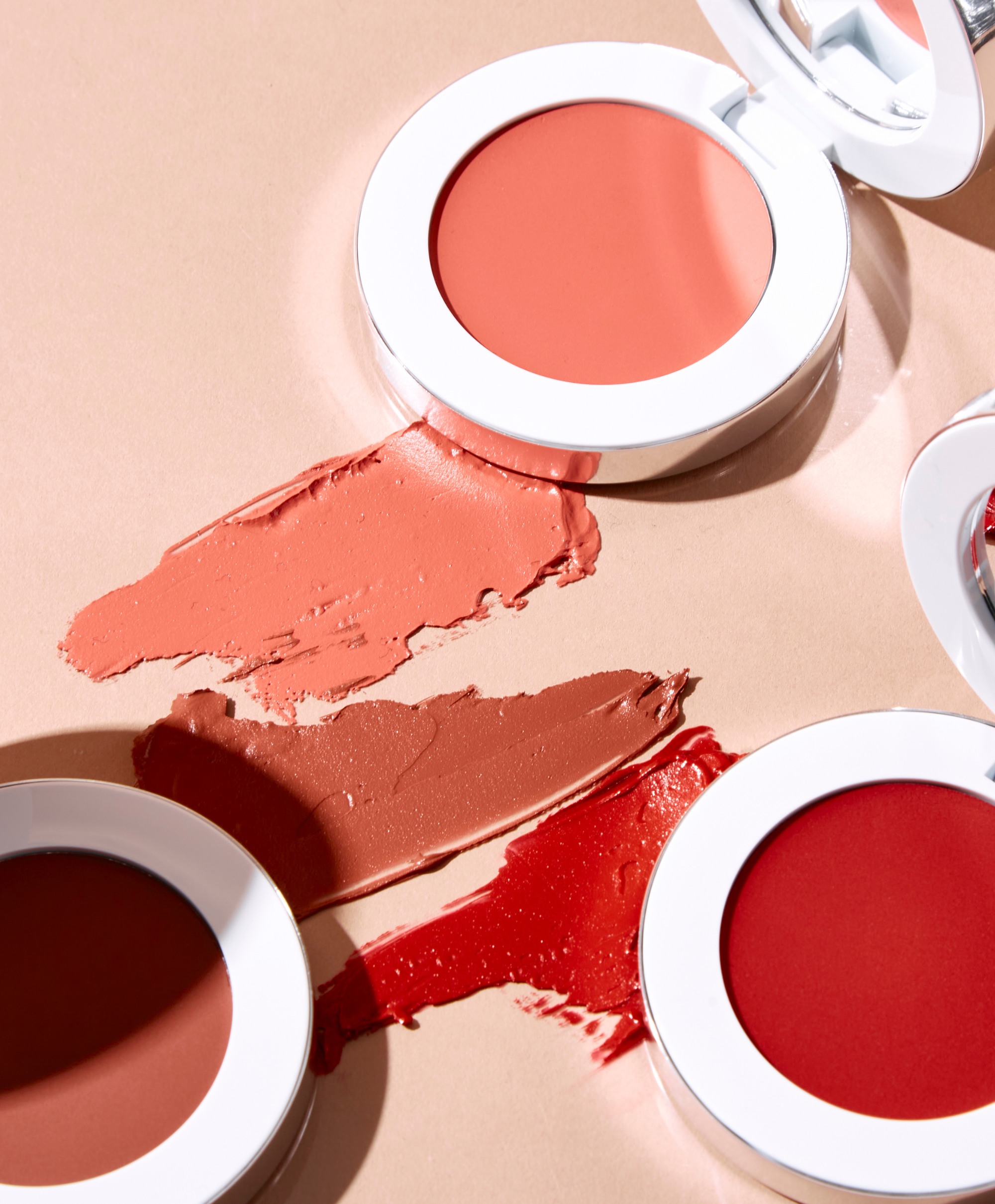 Colour Wonder Lip and Cheek Balm group shot with swatch texture