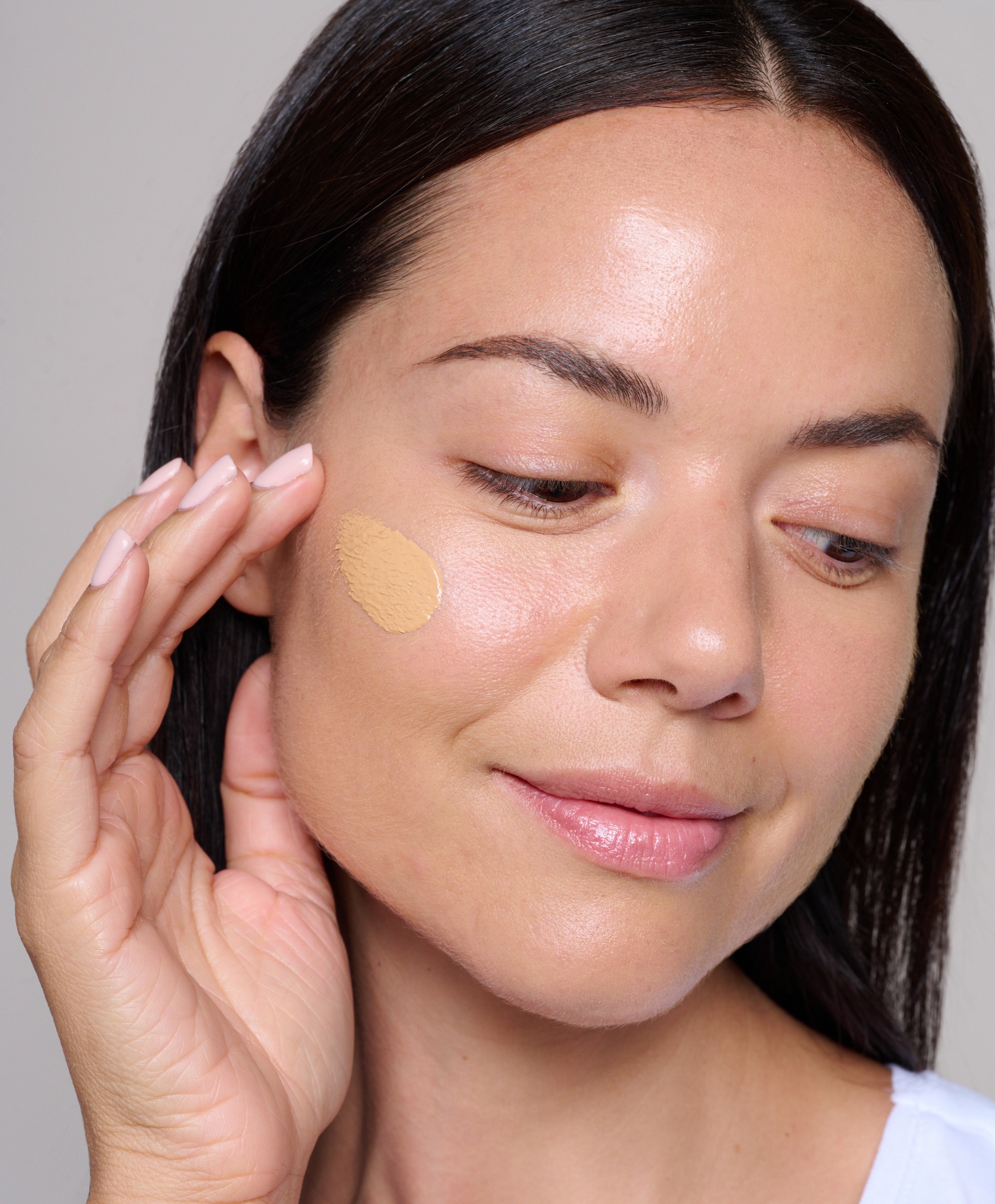 Model applying Skin Loving BB Cream