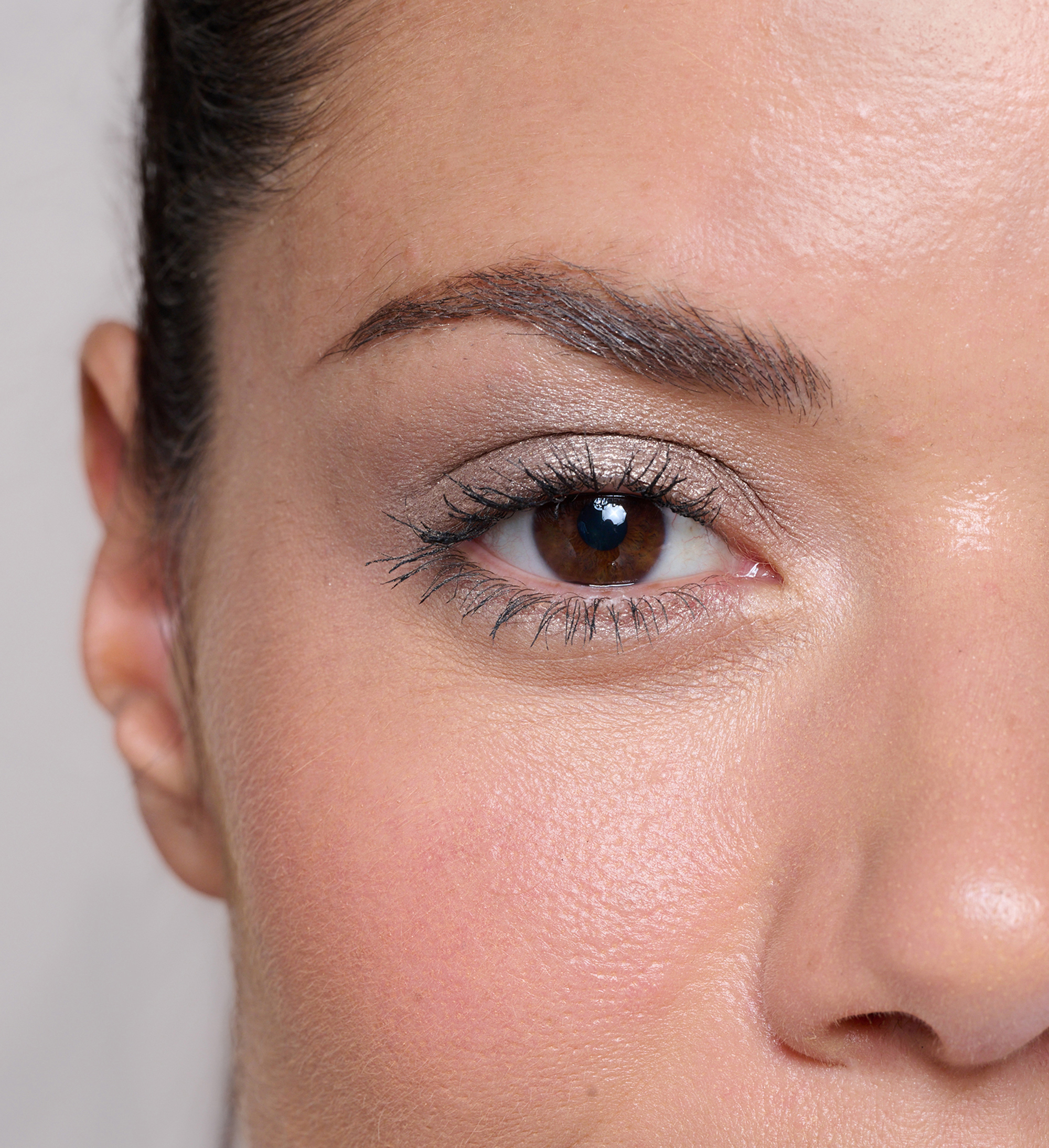 Model wearing Forever Eye Crayon Oyster and Waterproof Lash Lover Mascara