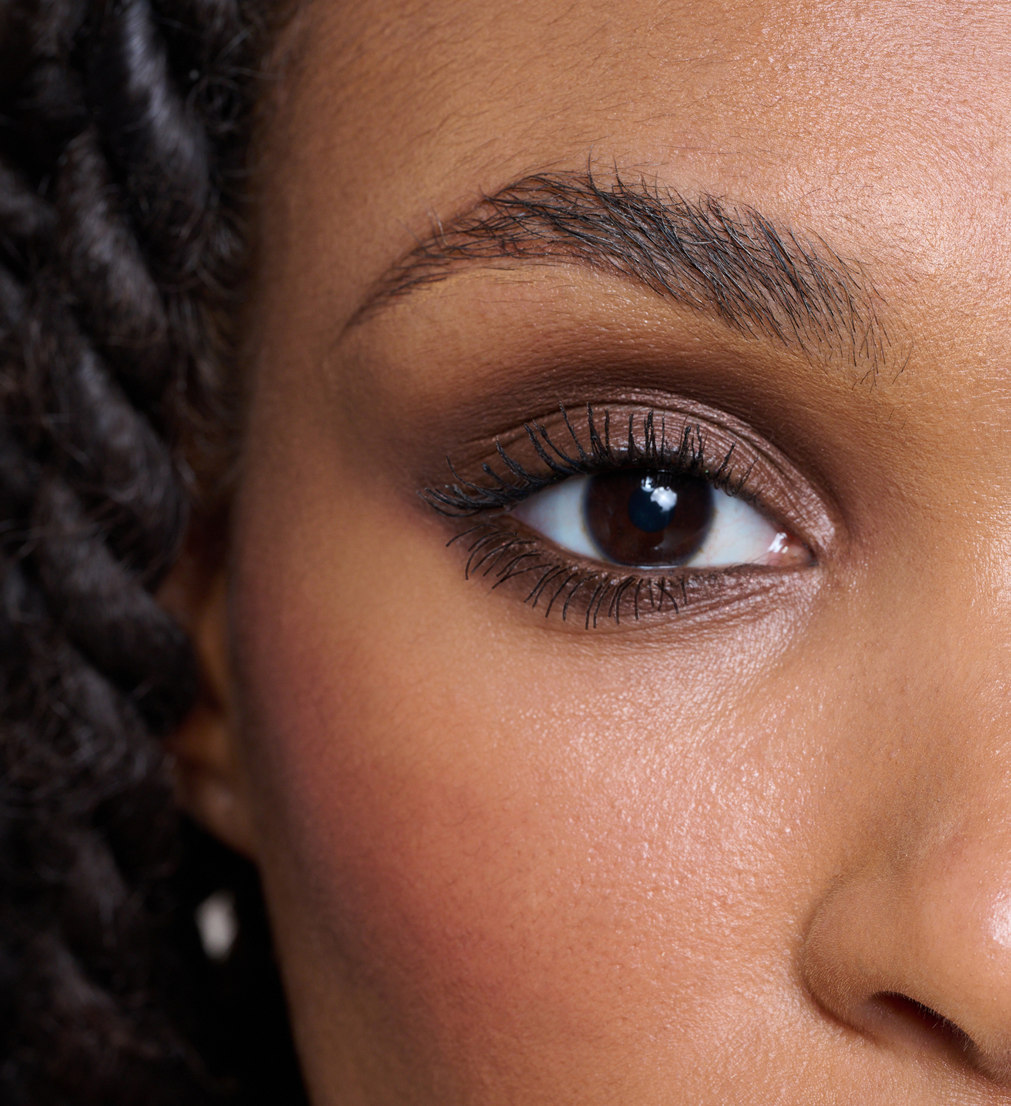 Model wearing Forever Eye Crayon Walnut and Intensifying Lash Lover Mascara