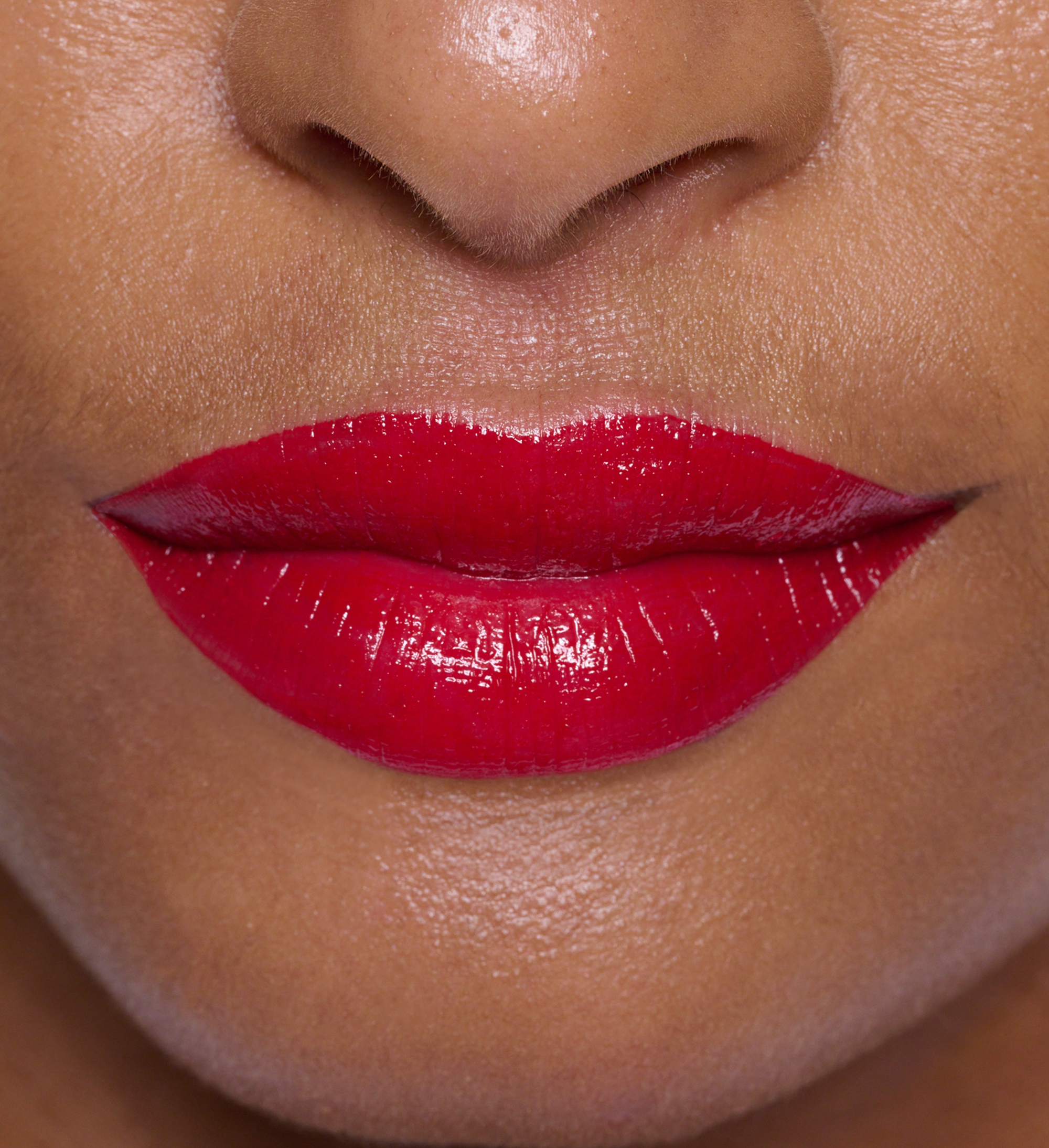 Macro of model wearing Hydraboost Lip Lover Lipstick in Fireside