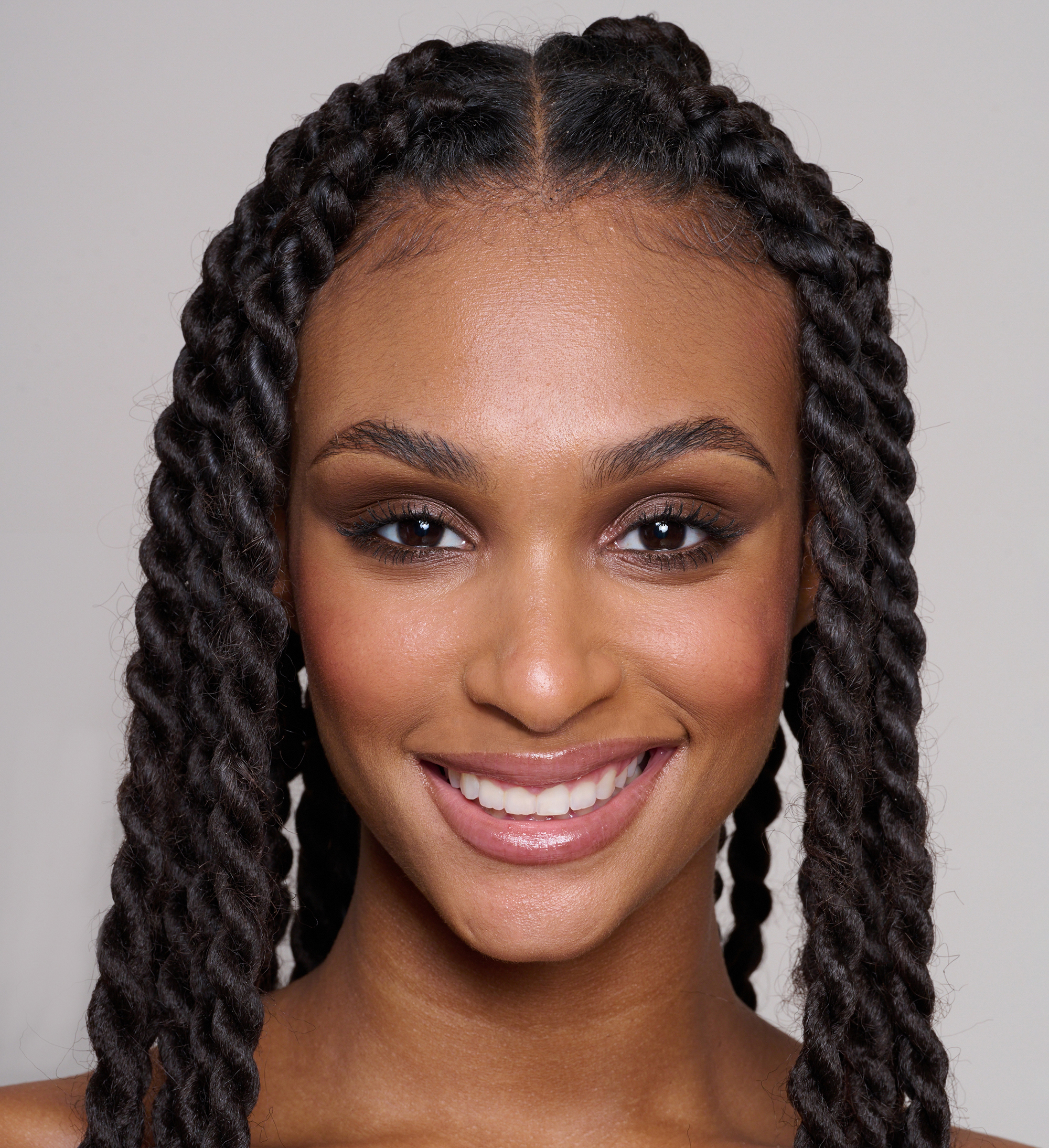 Model wearing Skin Loving BB Cream, Forever Eye Crayon Walnut and Intensifying Lash Lover Mascara