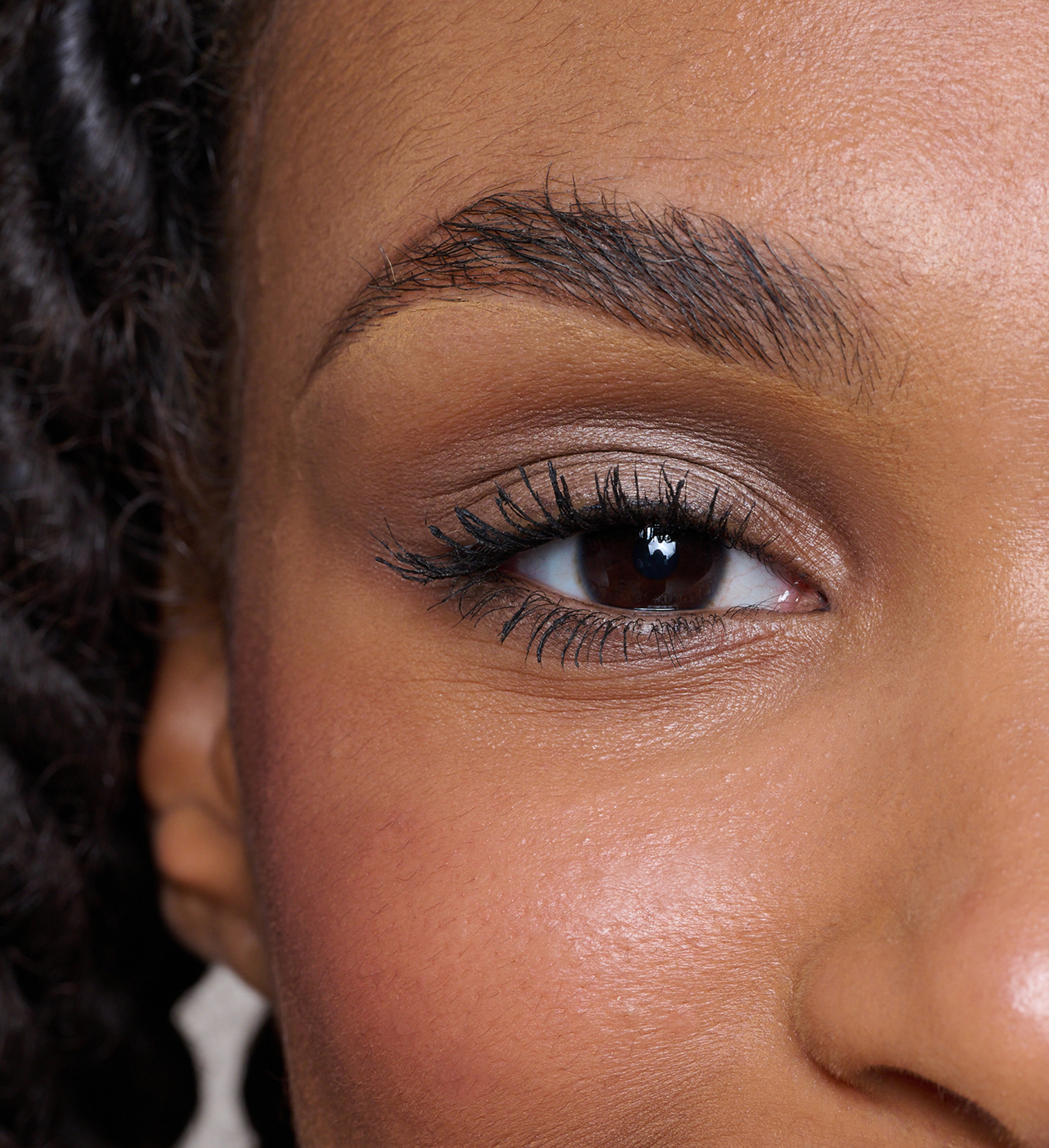 Model wearing Forever Eye Crayon Mocha and Intensifying Lash Lover Mascara