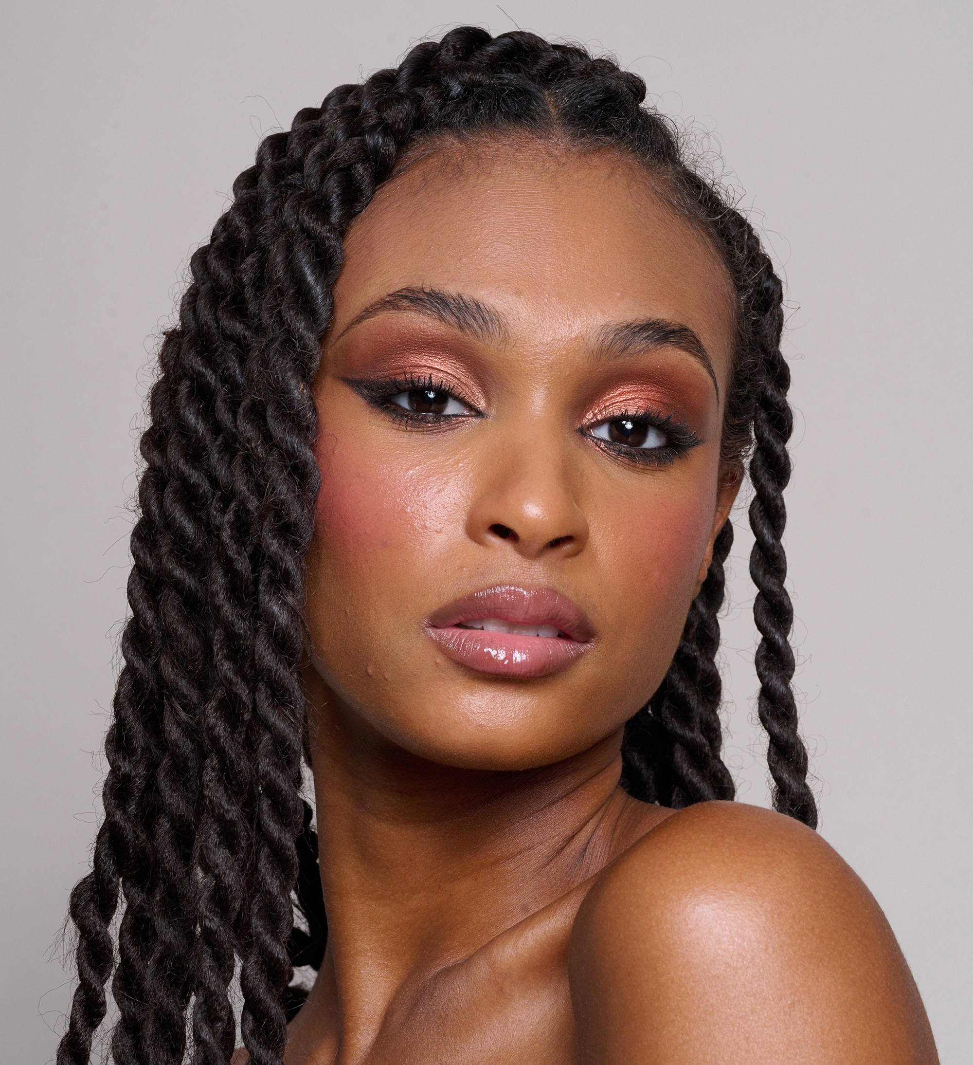 Model wearing Skin Loving BB Cream, ColourPlay Eyeshadow Palette in Sizzling Seduction, Skyliner and Intensifying Lash Lover Mascara