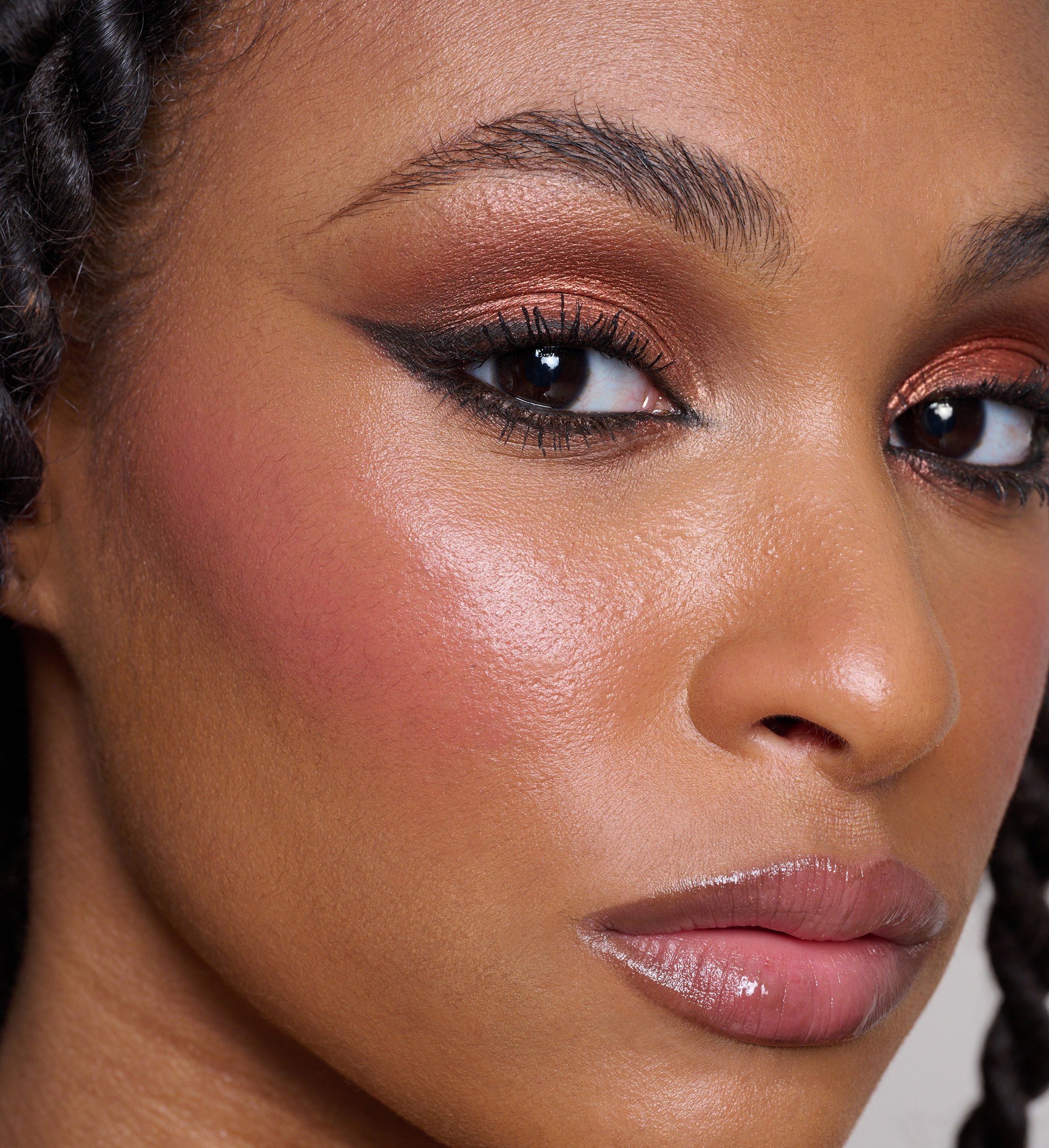 Model wearing Skin Loving BB Cream, ColourPlay Eyeshadow Palette in Sizzling Seduction, Skyliner and Intensifying Lash Lover Mascara