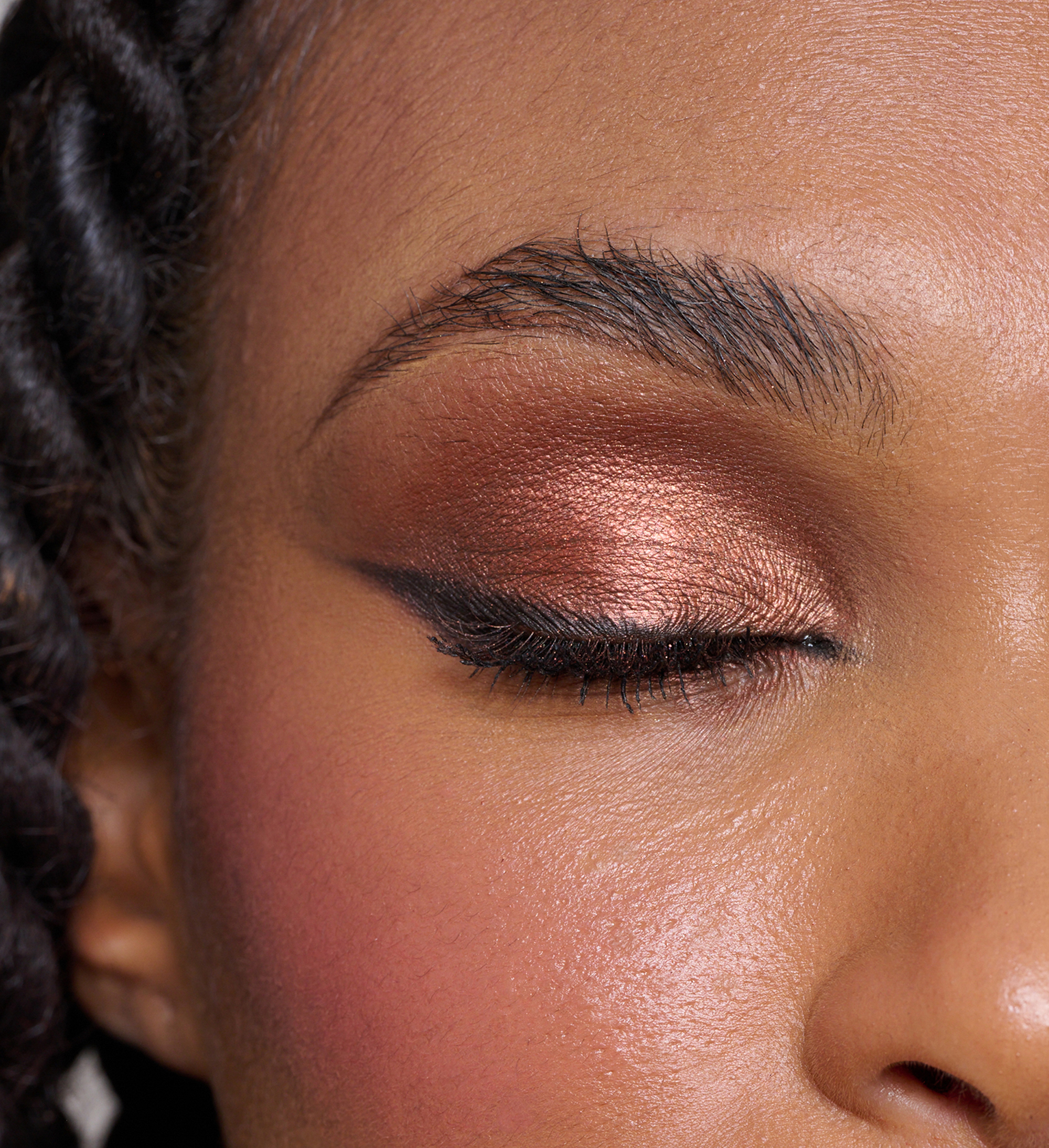 Model wearing ColourPlay Eyeshadow Palette in Sizzling Seduction, Skyliner and Intensifying Lash Lover Mascara
