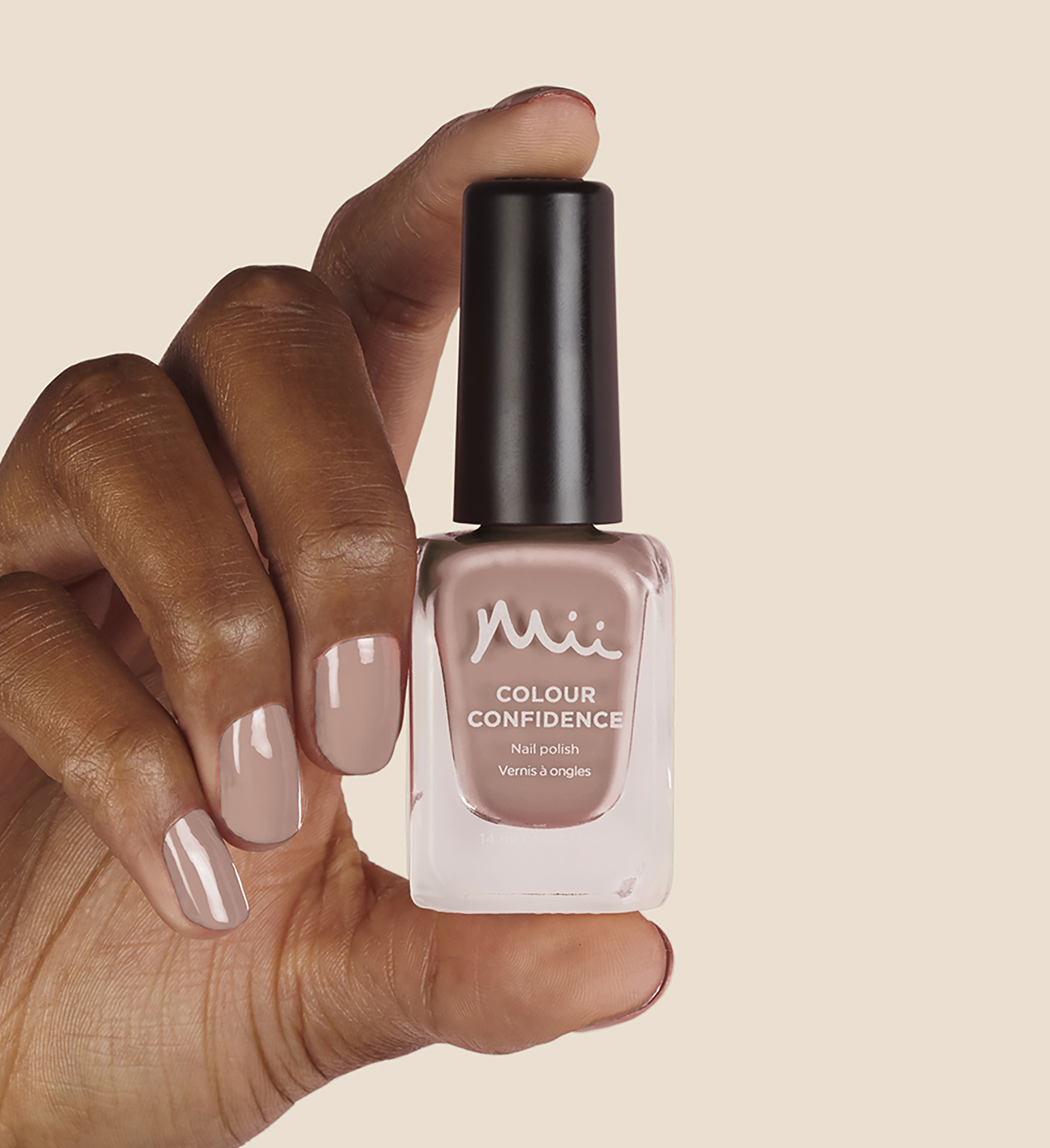 Model holding and wearing Coffee Eclair Colour Confidence Nail Polish