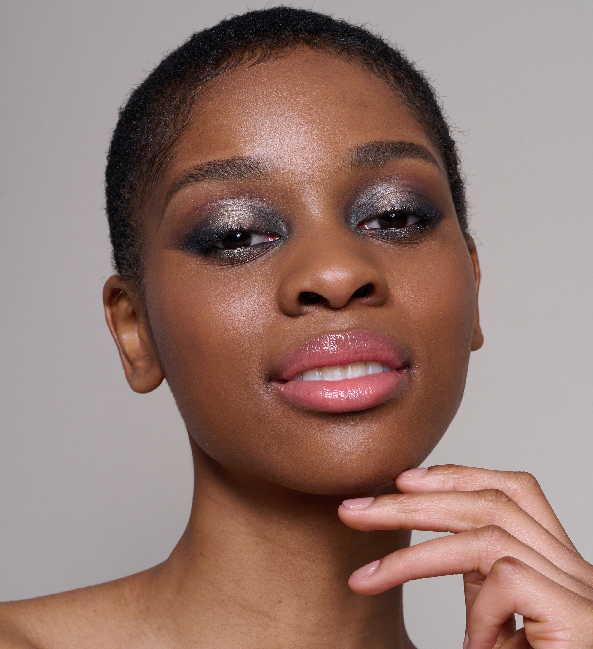 Model wearing Skin Loving BB Cream, Superboost Lash Lover mascara, Cheek Veil Liquid Blush, Cosmos Eye Palette and Precision Brow Detailer