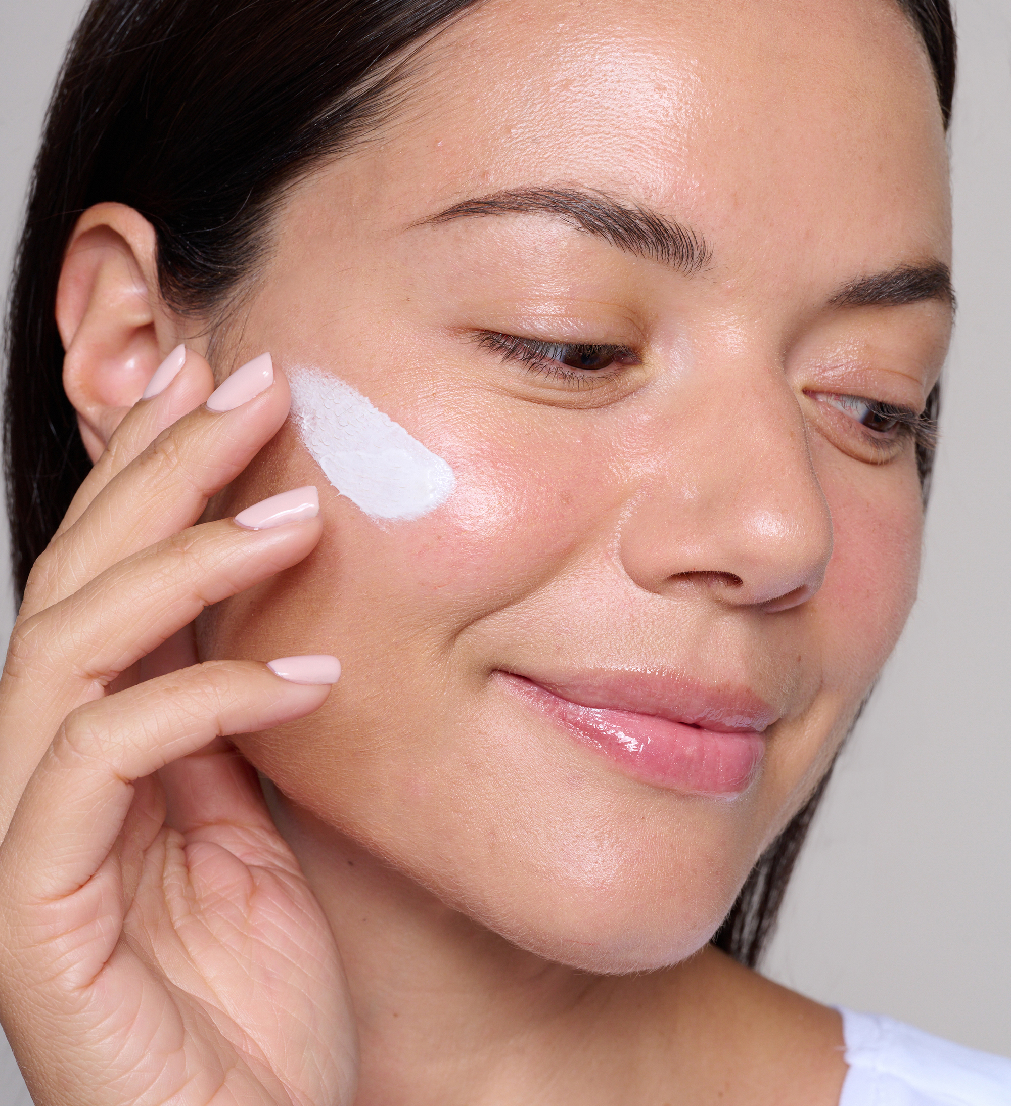 Model applying Skin Secret Cream Tint