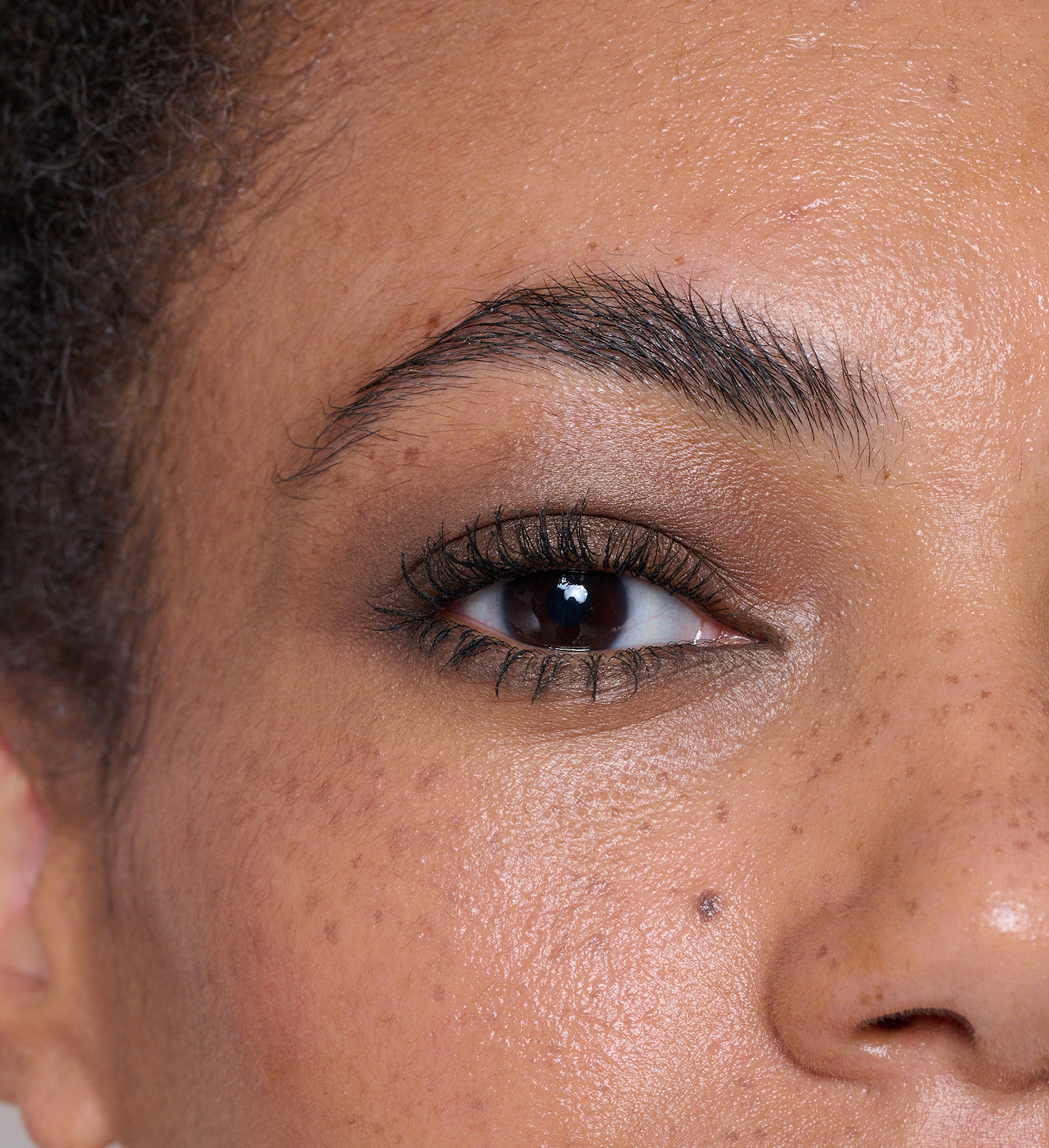 Model wearing Forever Eye Crayon in Vintage and Showstopping Lash Lover Mascara