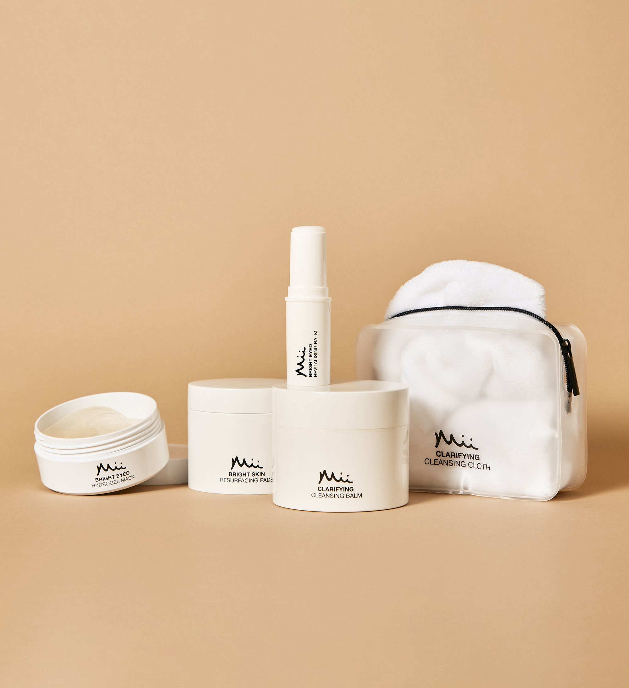 skin care lineup featuring hydrogel mask, revitalising eye balm, resurfacing pads and cleansing balm