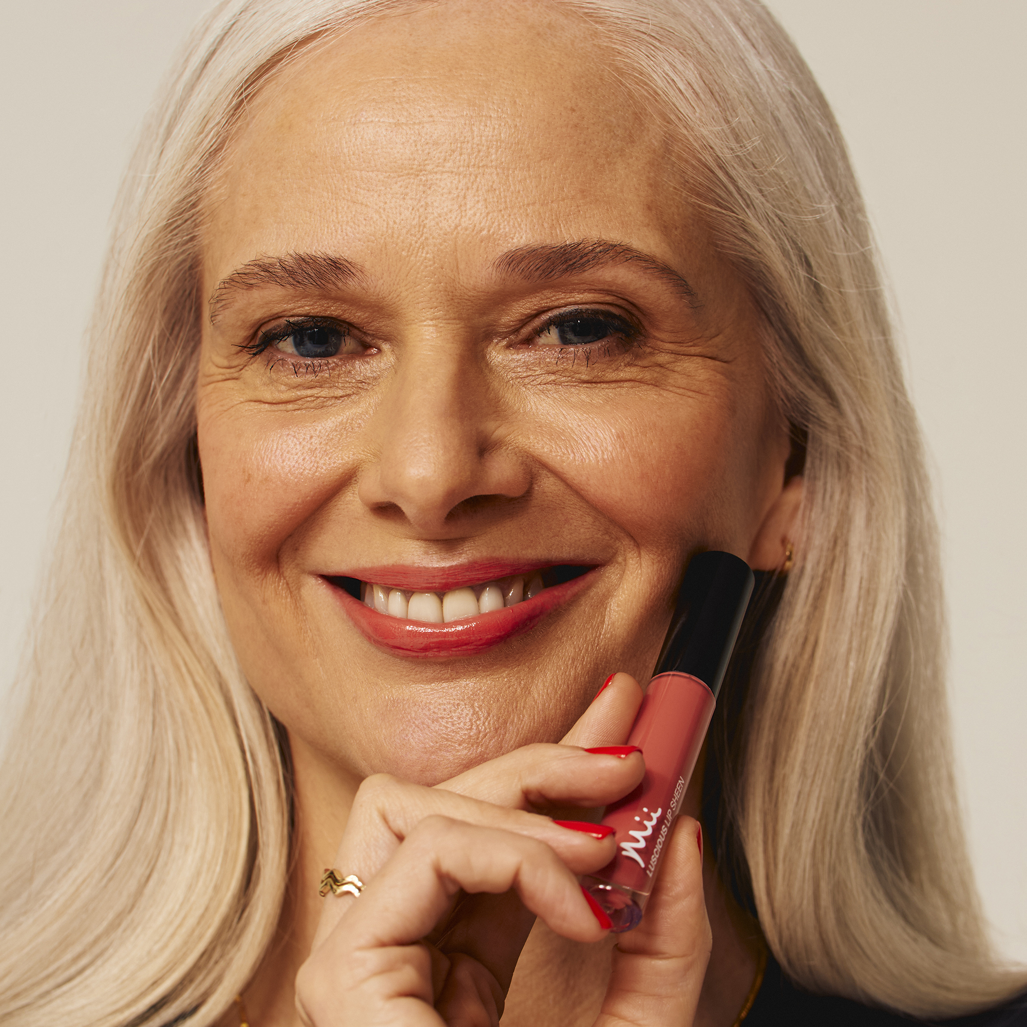 Model wearing Luscious Lip Sheen Lip Gloss in Desire