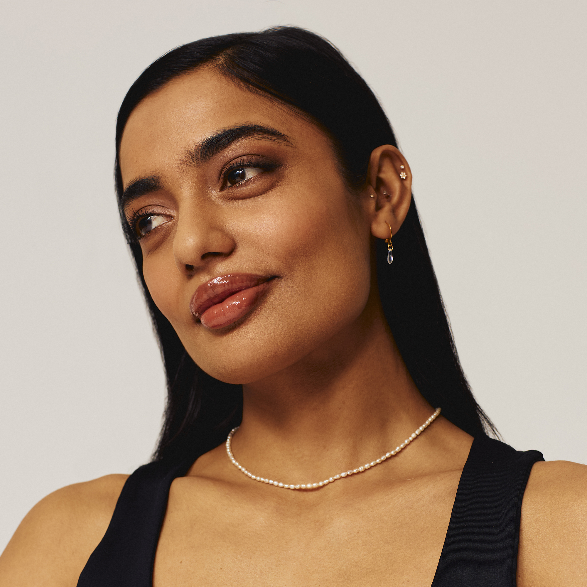 Model wearing Luscious Lip Sheen Lip Gloss in Foxy