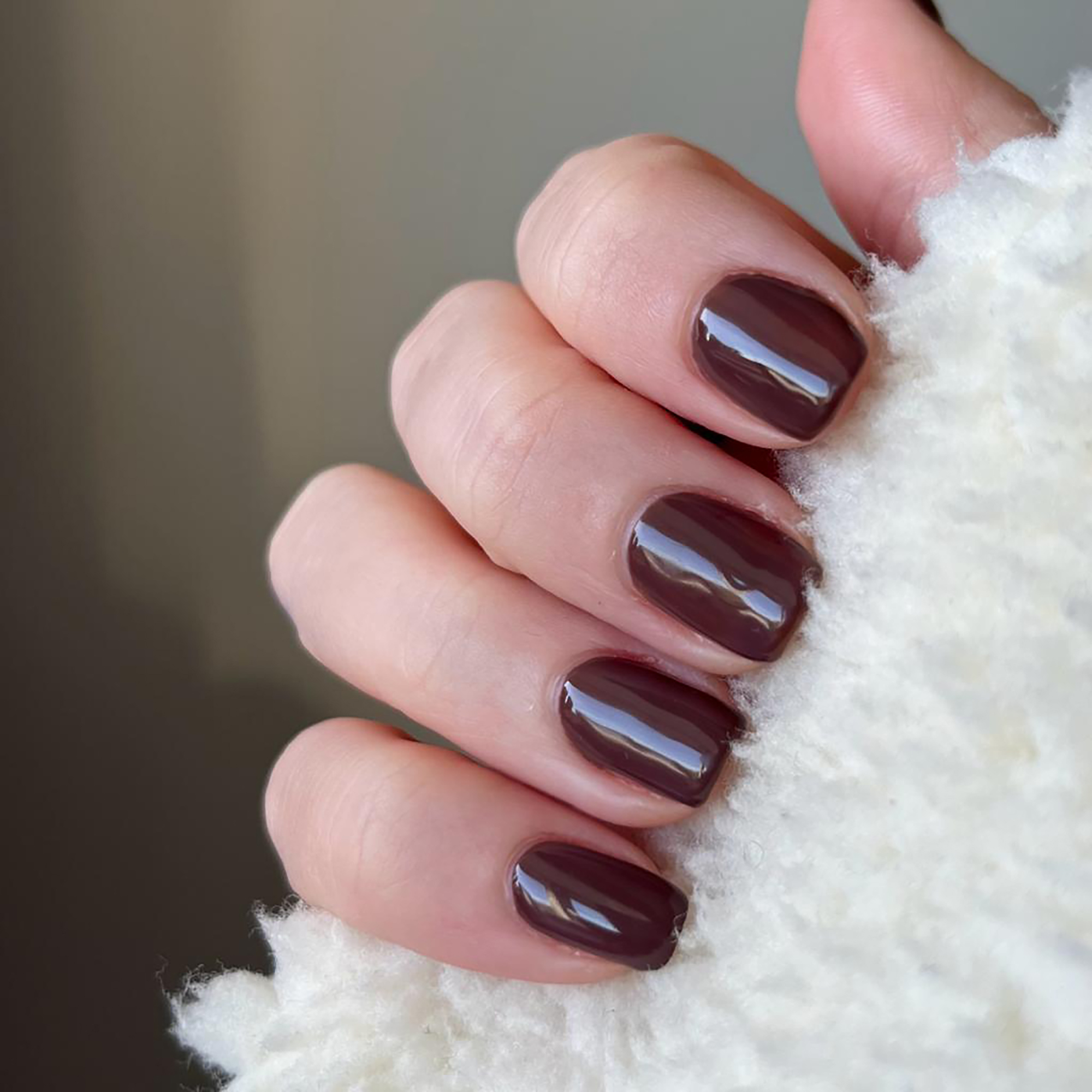 Model wearing Colour Confidence Nail Polish in Worldly Wise