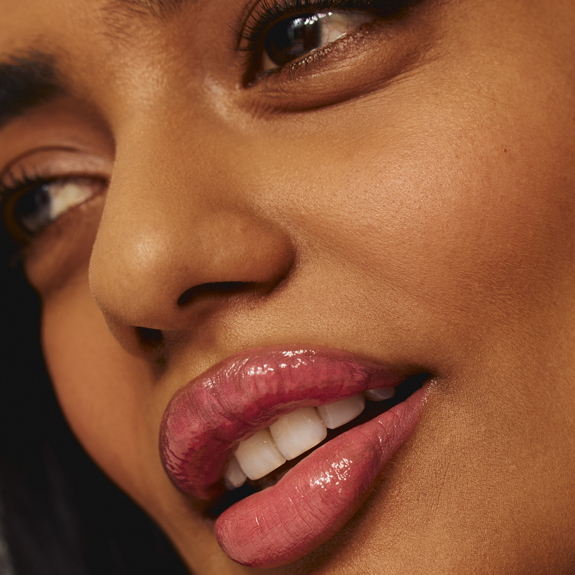 Model wearing Luscious Lip Sheen Lip Gloss in Sweet Pea