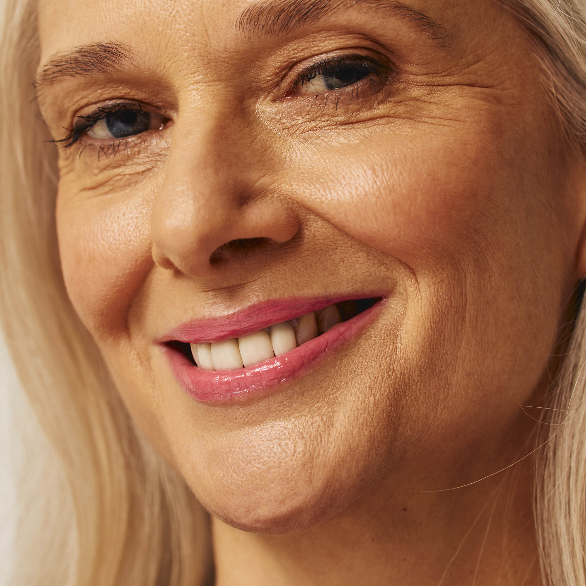 Model wearing Luscious Lip Sheen Lip Gloss in Sweet Pea