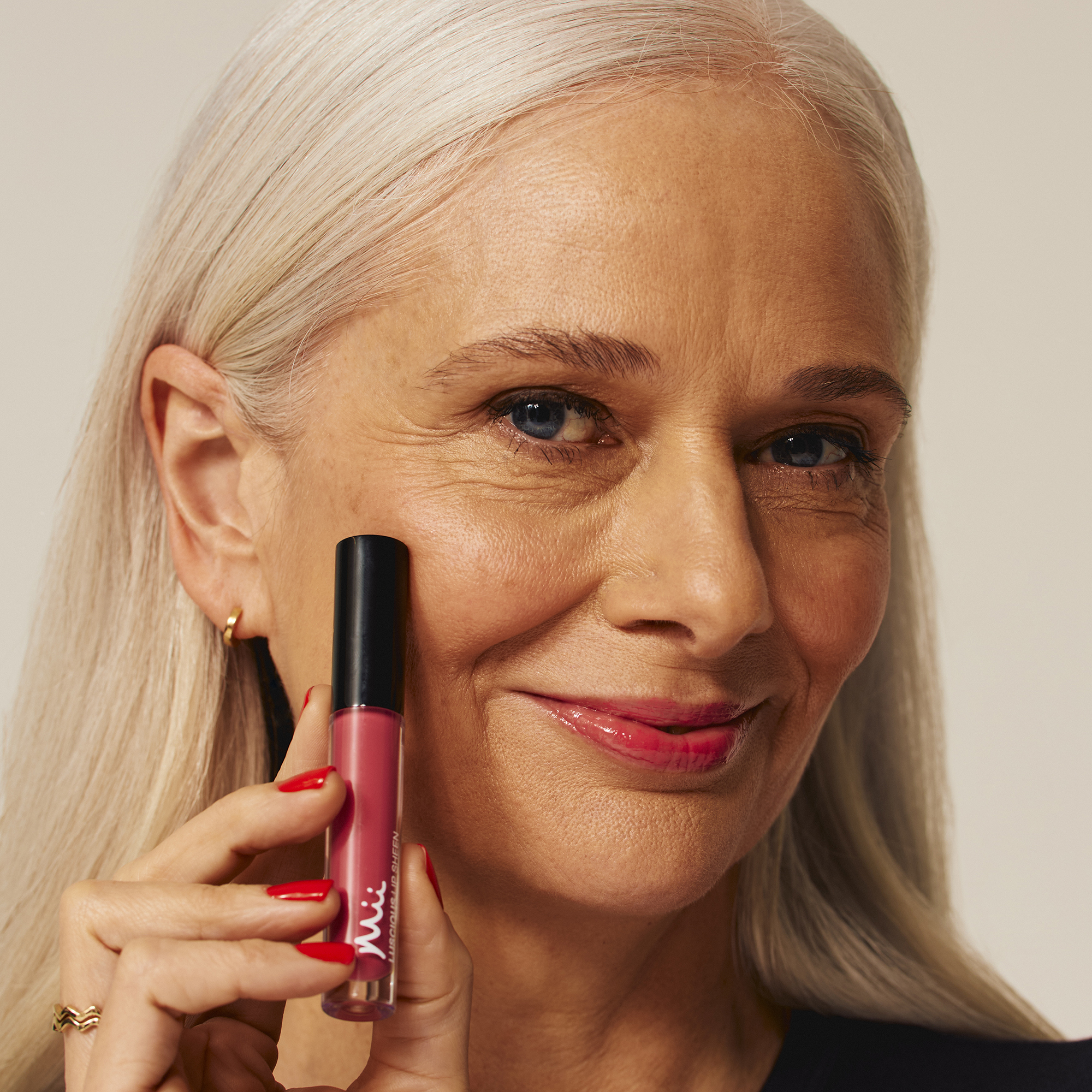 Model wearing Luscious Lip Sheen Lip Gloss in Flair