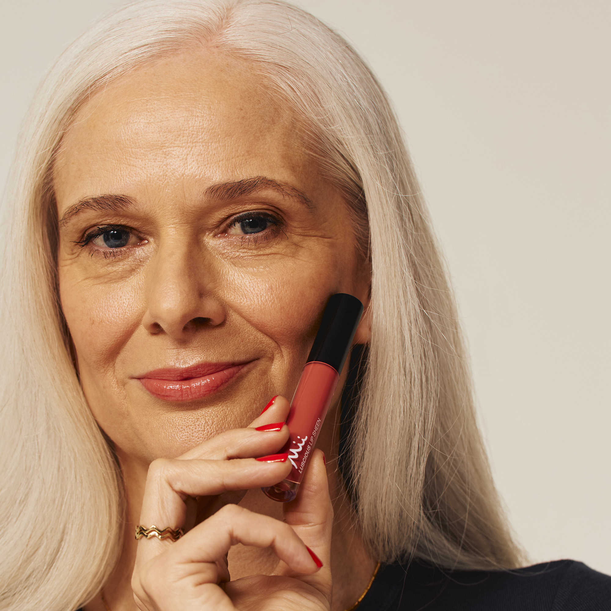 Model wearing Luscious Lip Sheen Lip Gloss in Charmed