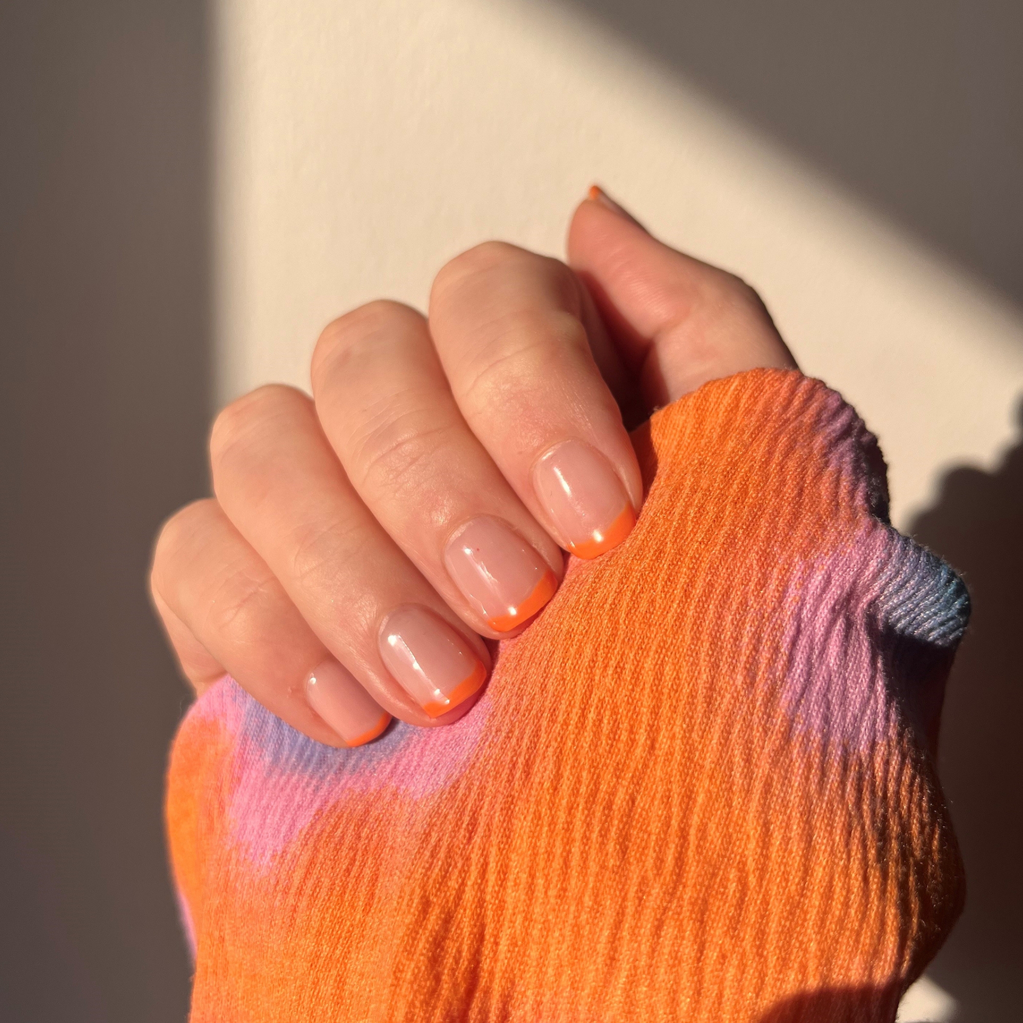 Model wearing Modern French manicure with Make Believe Colour Confidence Nail Polish