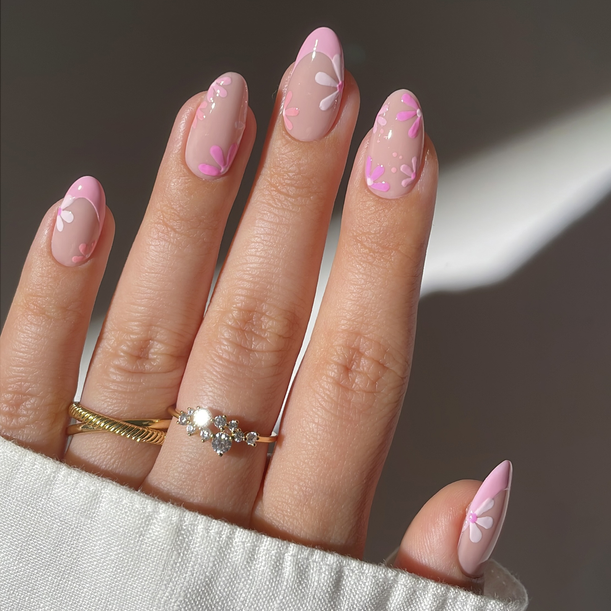 Model wearing a floral nail art design