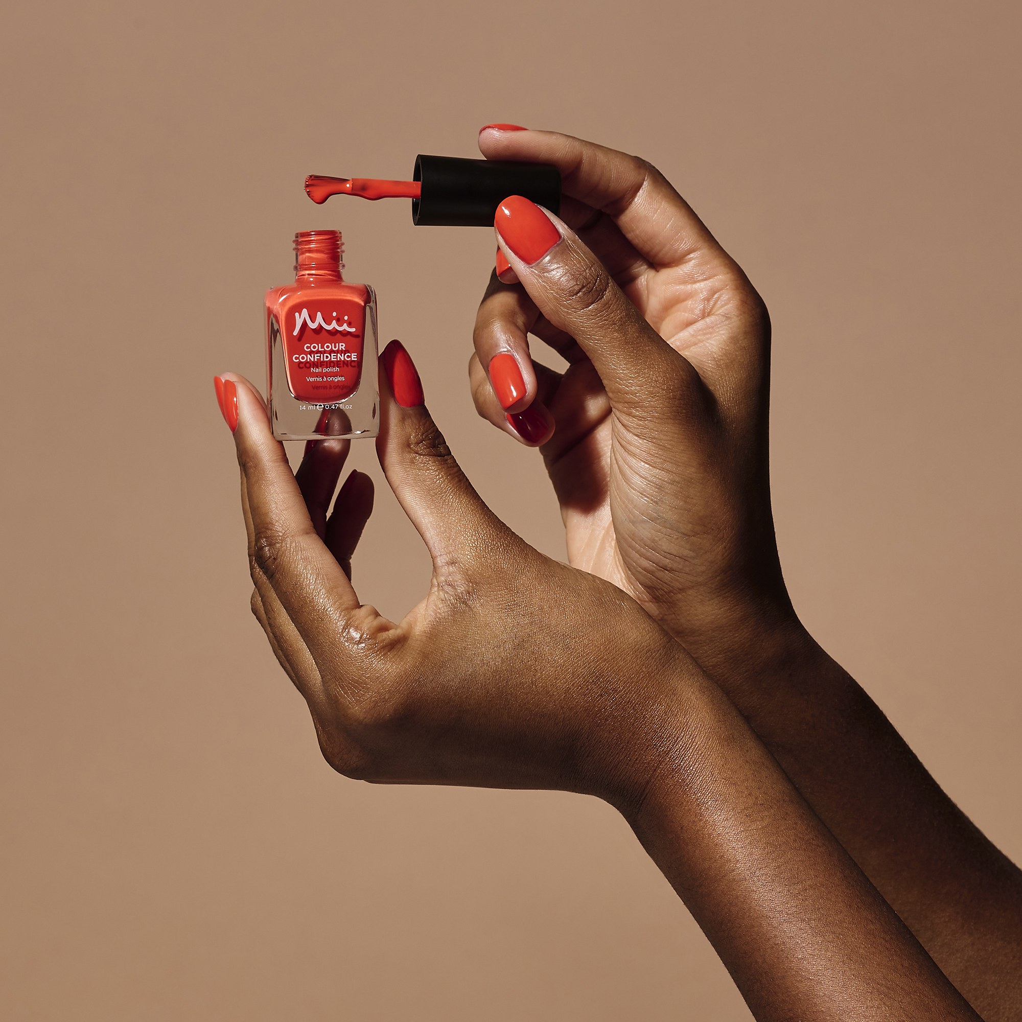 Model holding Wildly Wonderful Colour Confidence Nail Polish
