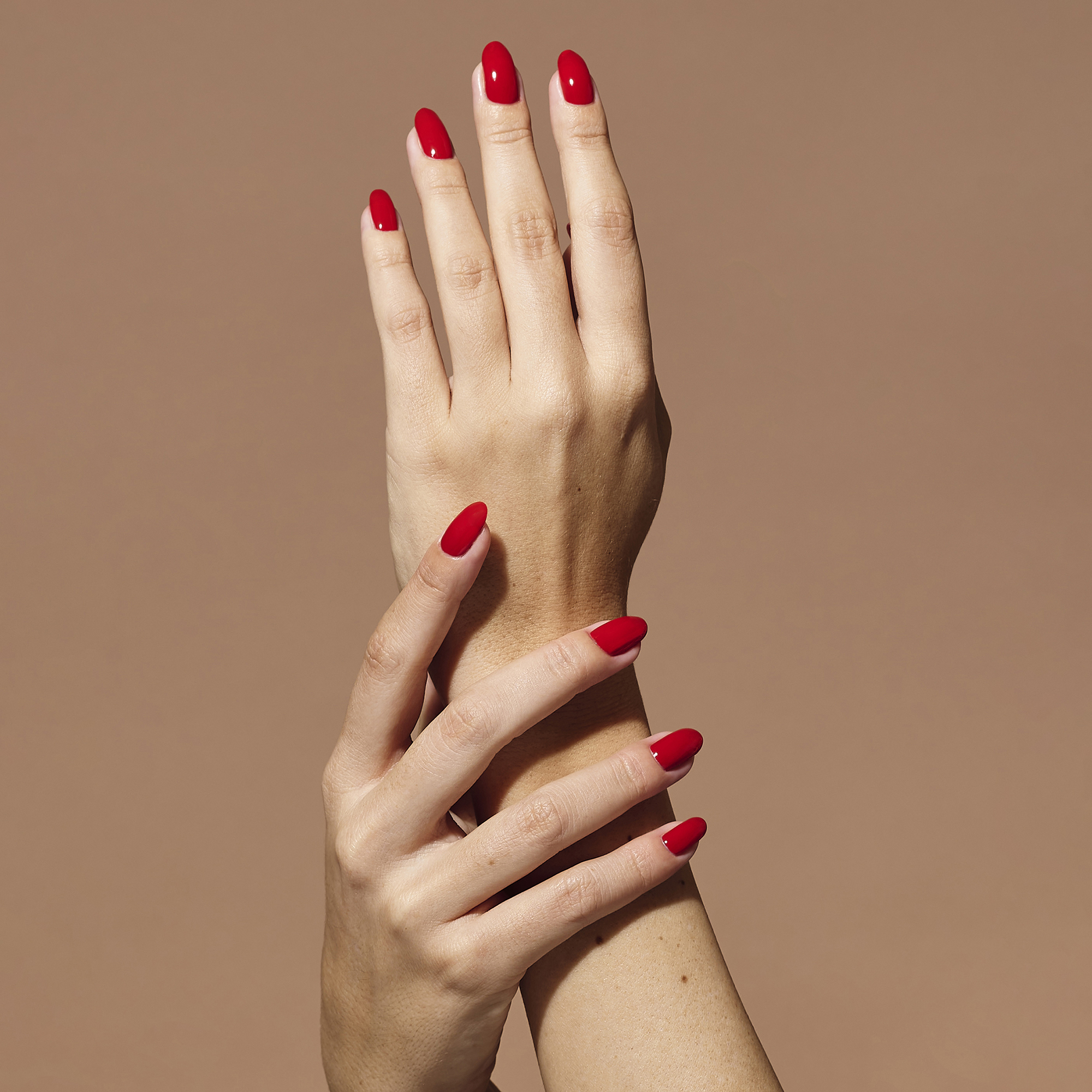Model wearing Red Devil Colour Confidence Nail Polish