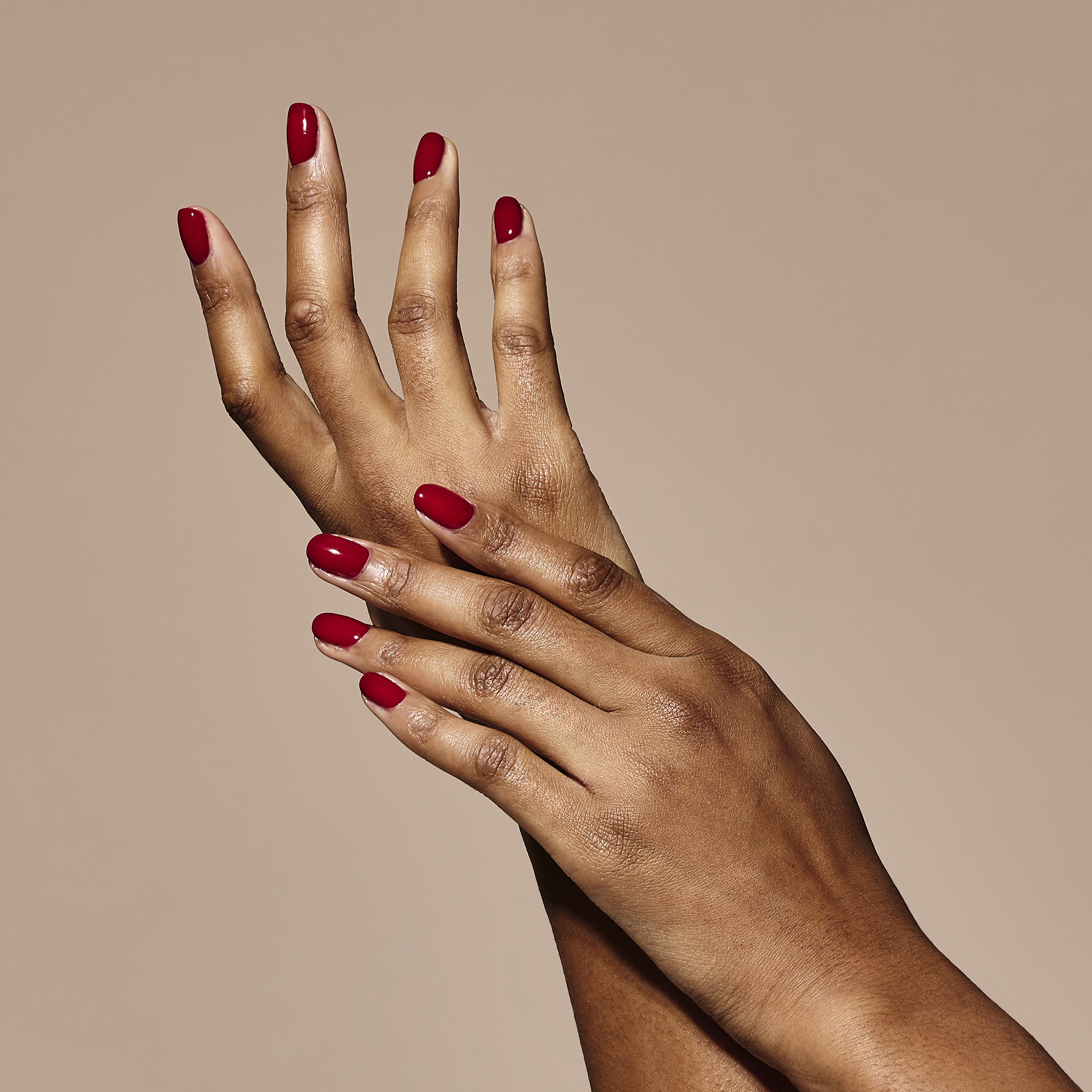 Model wearing Bloodline Cherry Colour Confidence Nail Polish