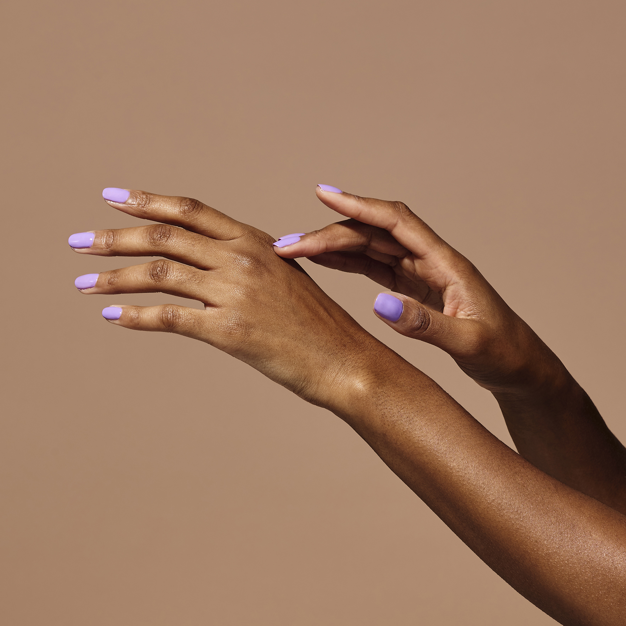 Model wearing Masquerade Colour Confidence Nail Polish