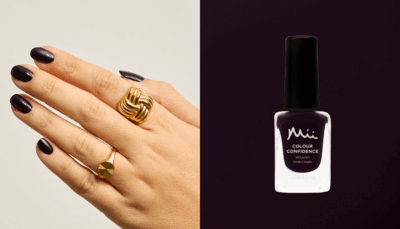 Model wearing Bewitched Colour Confidence Nail Polish and a bottle of Bewitched Colour Confidence Nail Polish