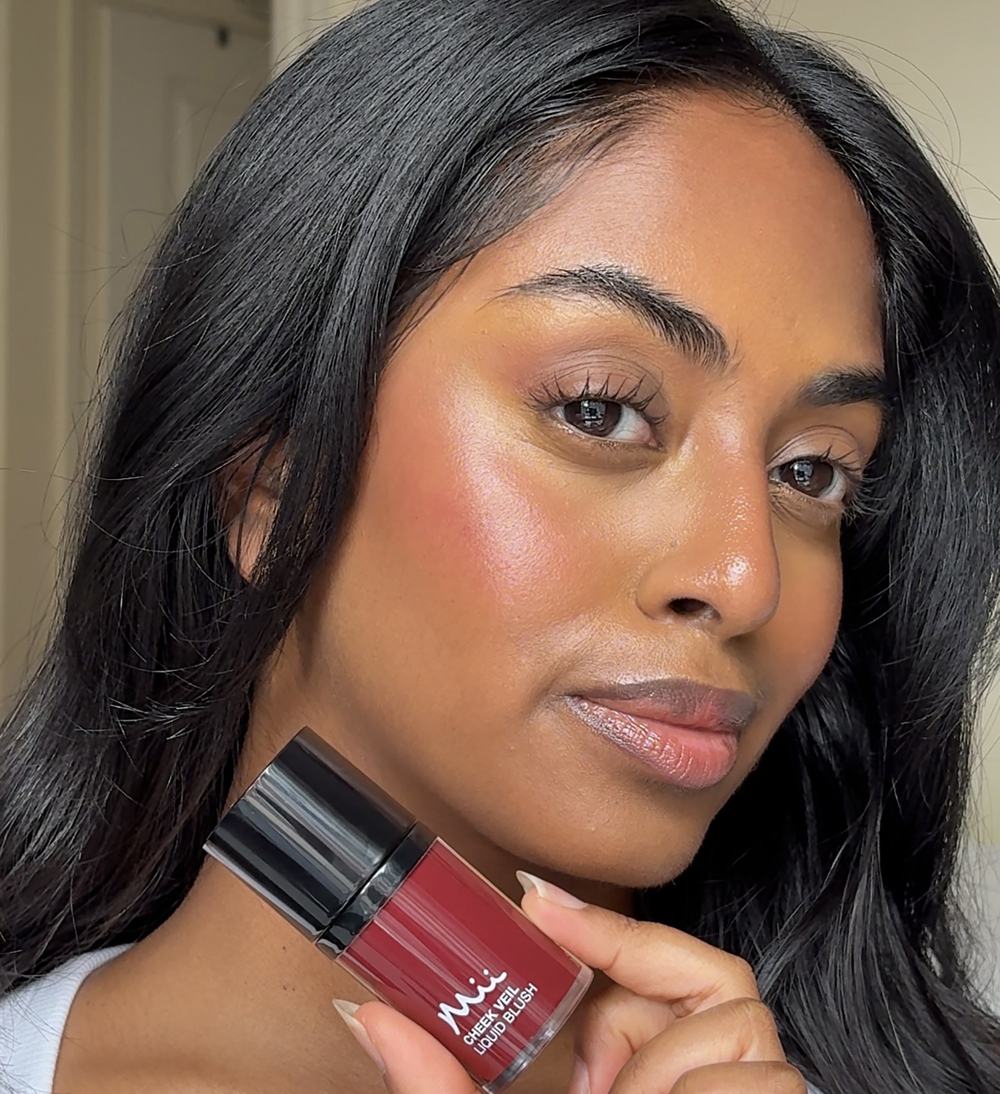 Model wearing Cheek Veil Liquid Blush in Ravishing