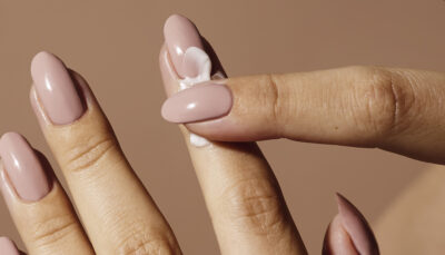 Image of model applying Refine + Pamper Intensive Cuticle Cream
