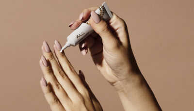 Model applying Refine + Pamper Cuticle Cream