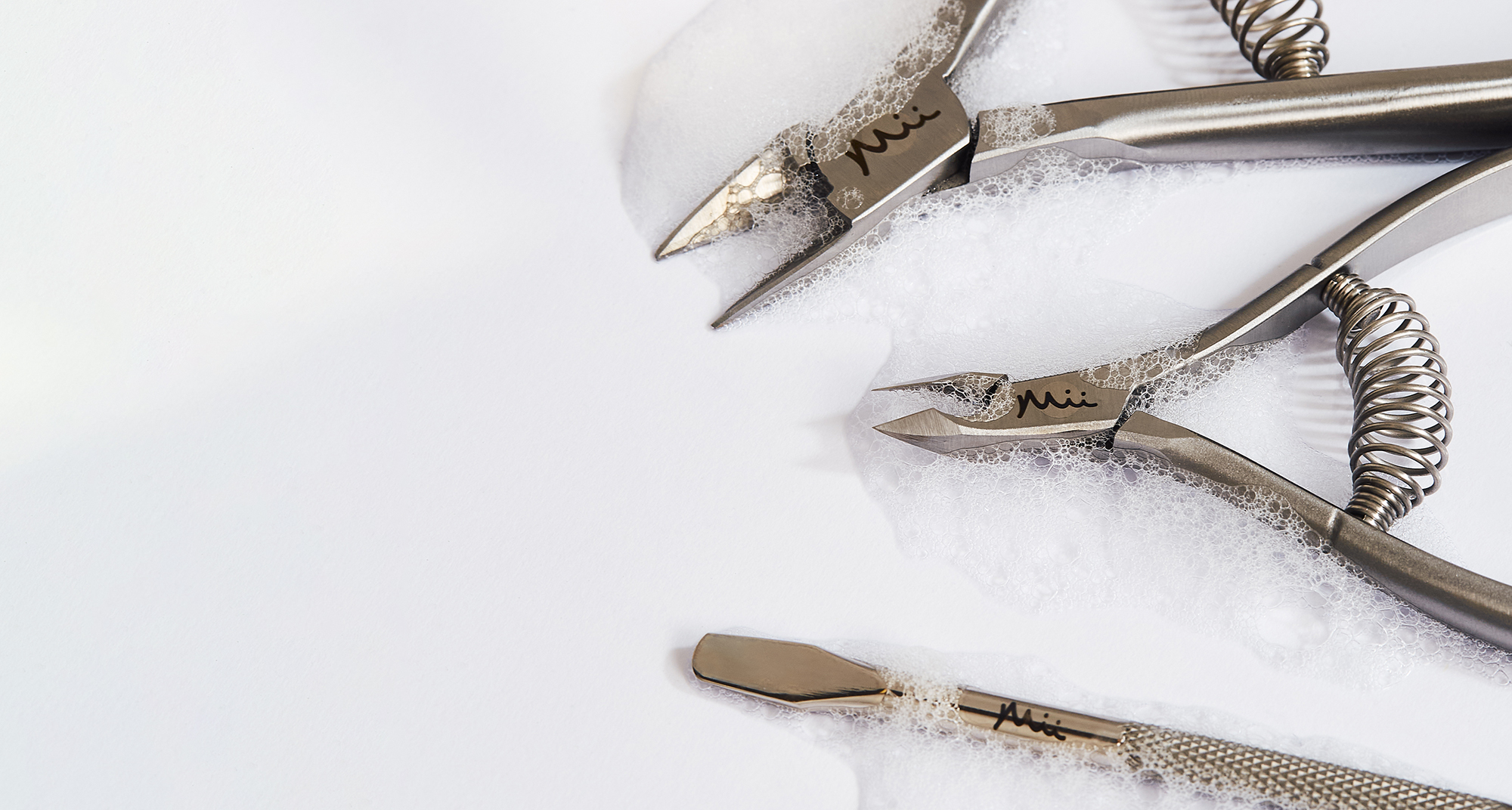 Neat + Tidy nail tools in bubbles