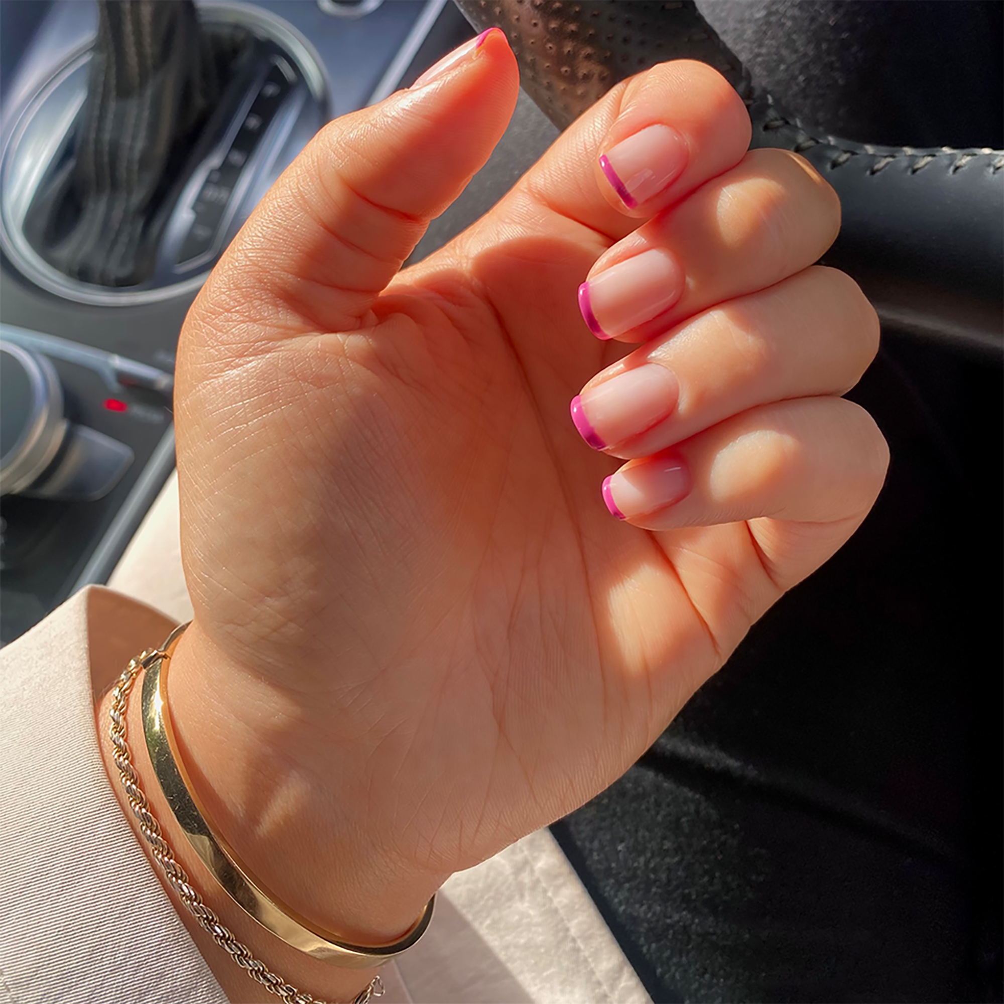 Manicured hand with a french tip look using Je Ne Sais Quoi Colour Confidence Nail Polish