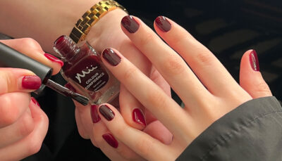 London Fashion Week - nail tech applying Rosted Chestnut Colour Confidence nail polish onto models nails