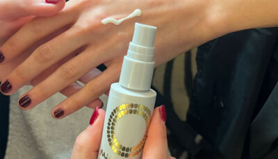 London Fashion Week - nail tech applying Care + Caress Hand Serum onto models hands