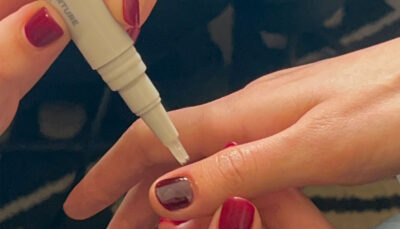 London Fashion Week - nail tech applying Nourish +Nurture Nail and Cuticle Oil Pen onto models nails