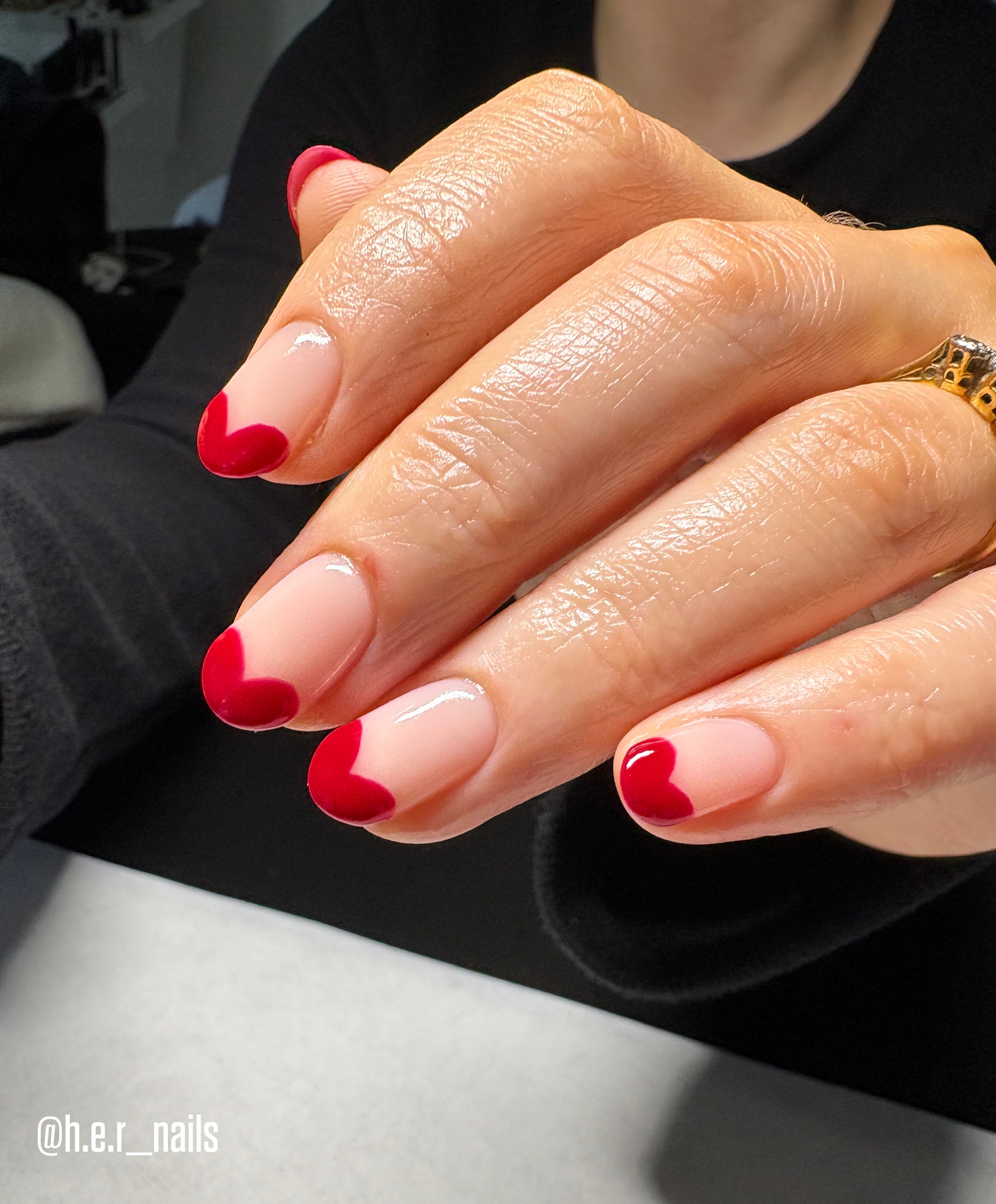 Final look of heart-shapped tips manicure