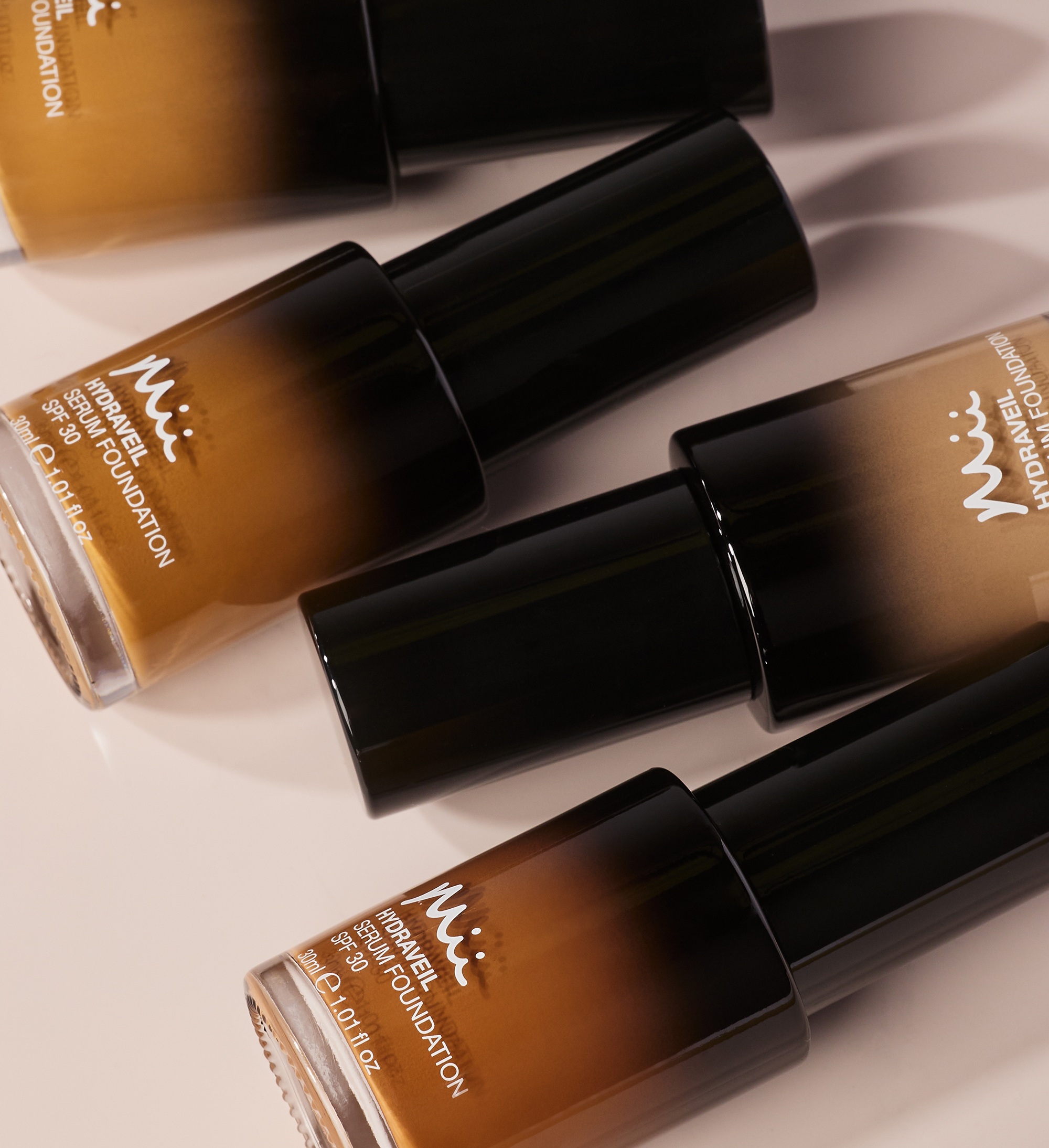 Hydraveil Serum Foundation group shot against a neutral background - Hydraveil Serum Foundation in shades 12, 14, 16, and 17