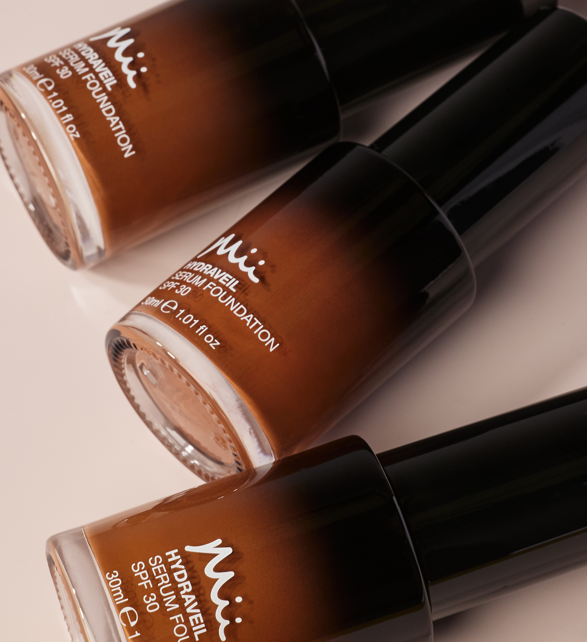 Hydraveil Serum Foundation group shot in shades 18, 19, and 20 against a neutral background