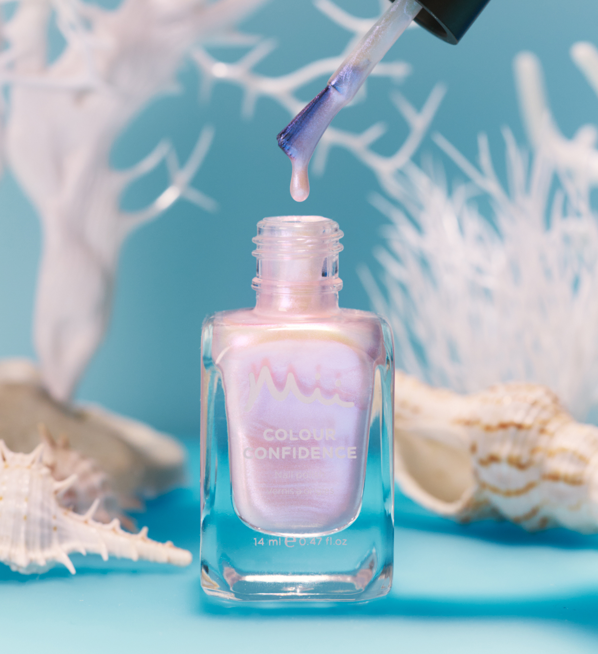 Dripping shot of Shell Seeker Colour Confidence Nail Polish against a blue background with white plants